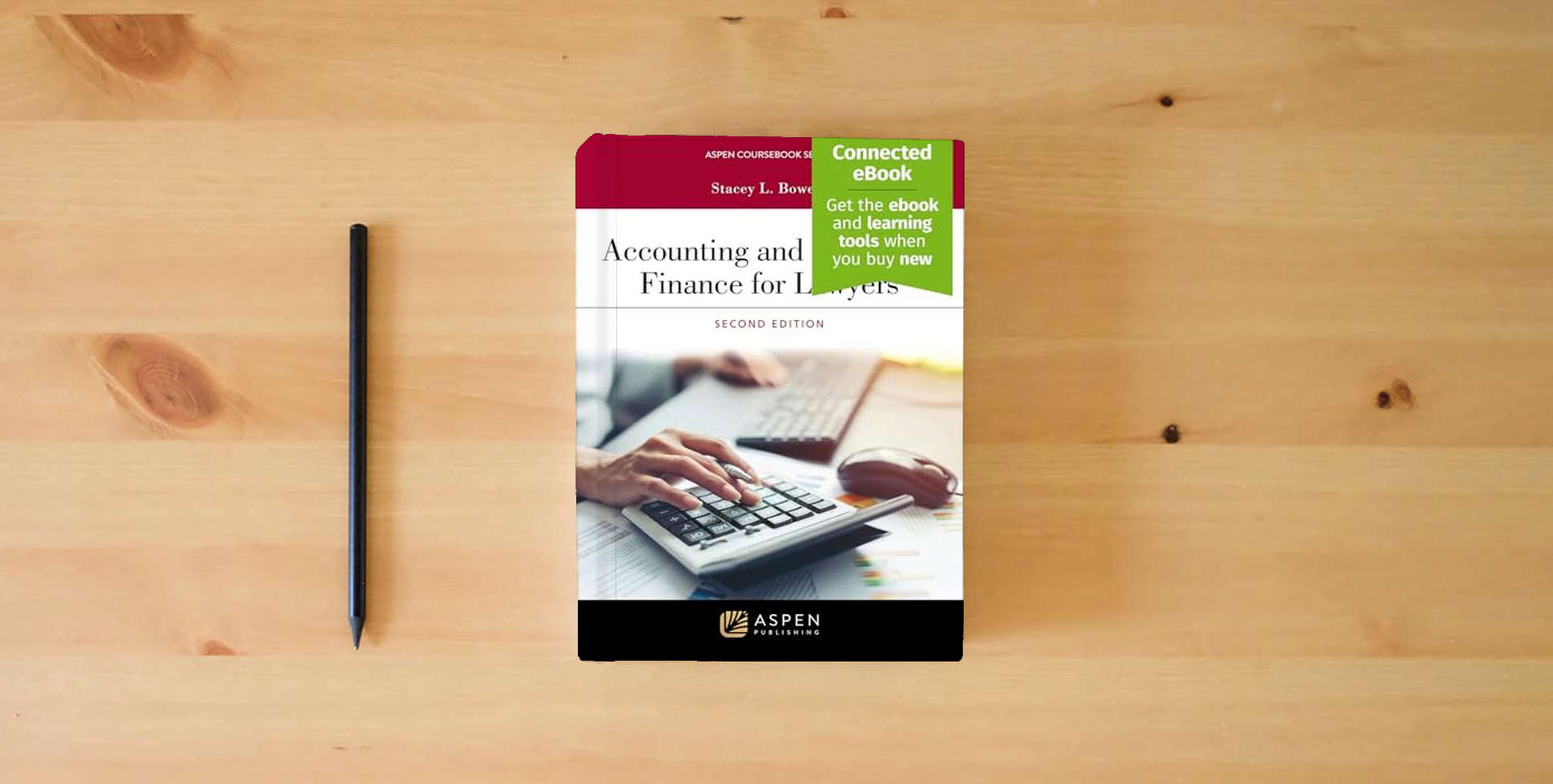The book Accounting and Corporate Finance For Lawyers: [Connected eBook] (Aspen Coursebook Series) is on the table