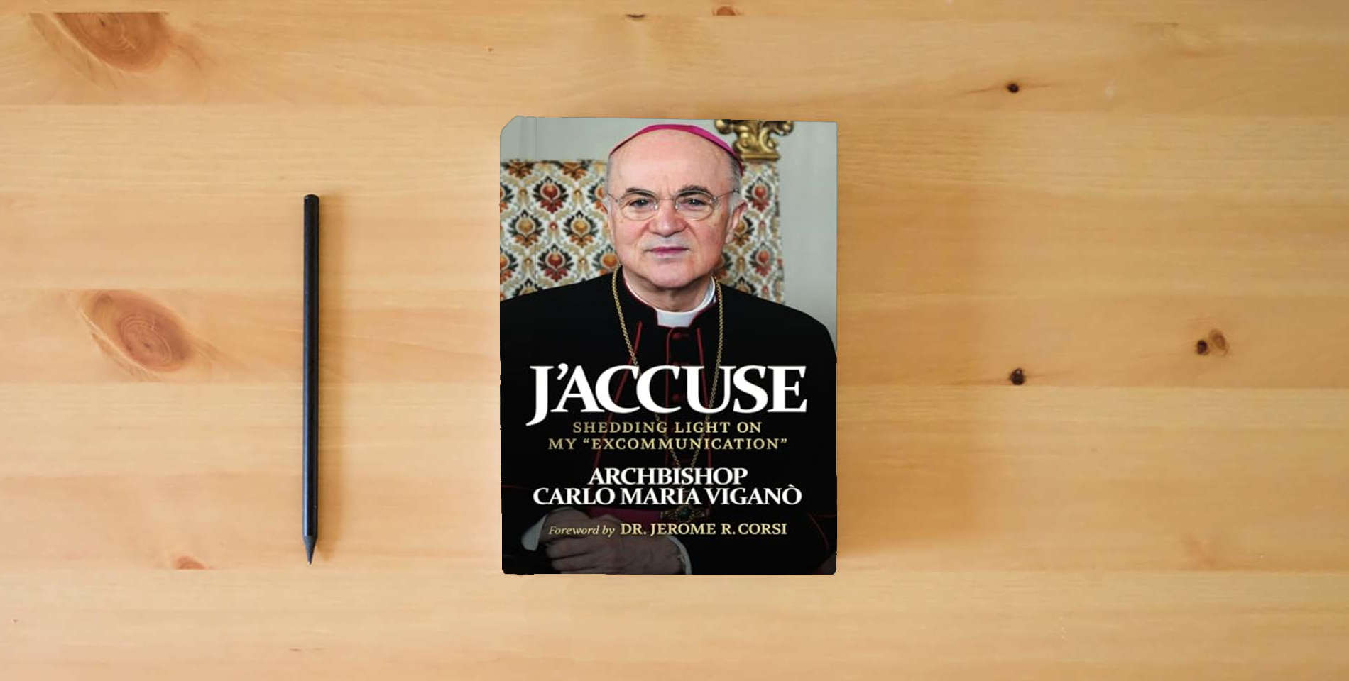 The book J'Accuse: Shedding Light on my "Excommunication" is on the table