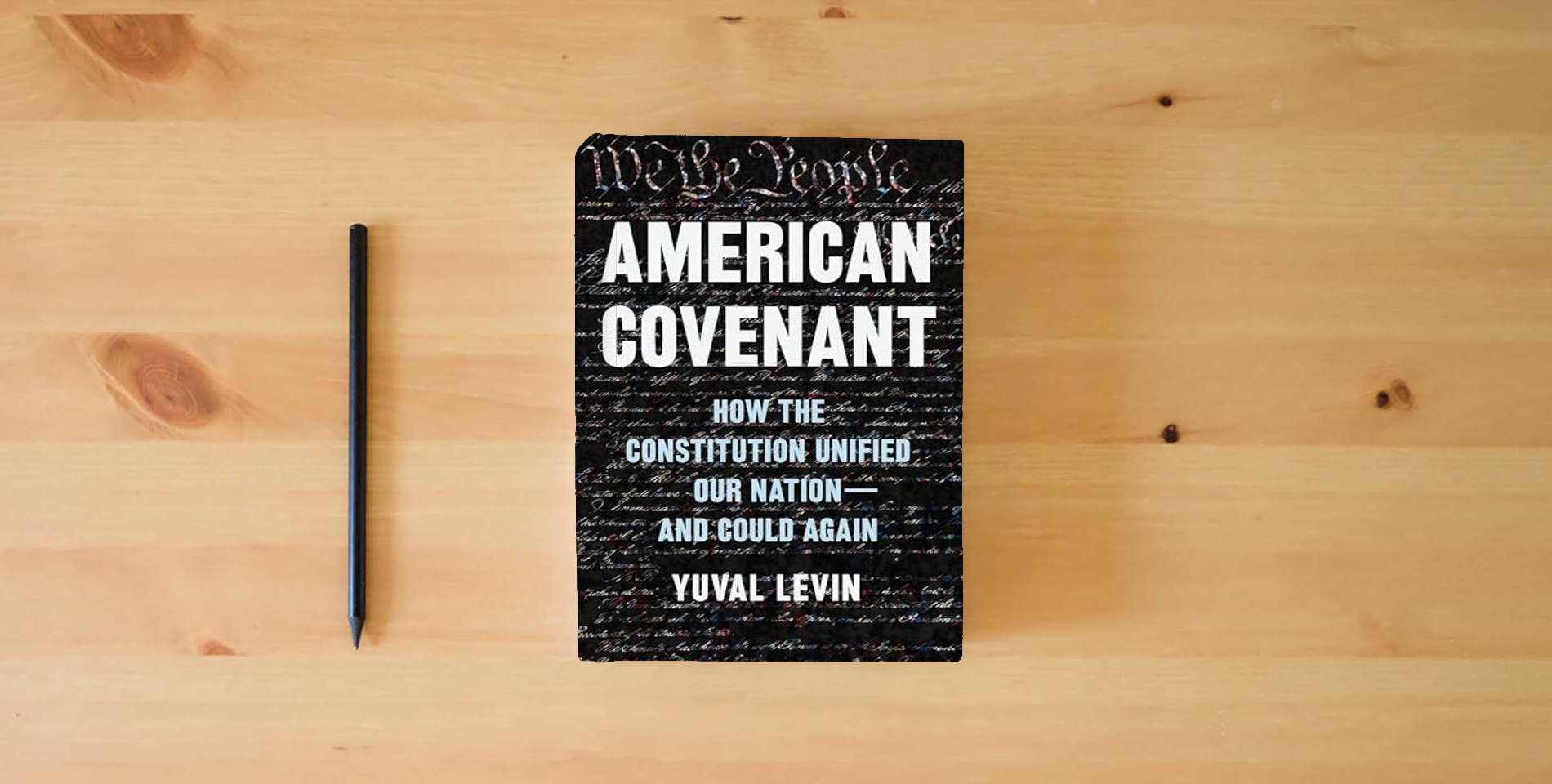 The book American Covenant: How the Constitution Unified Our Nation―and Could Again is on the table
