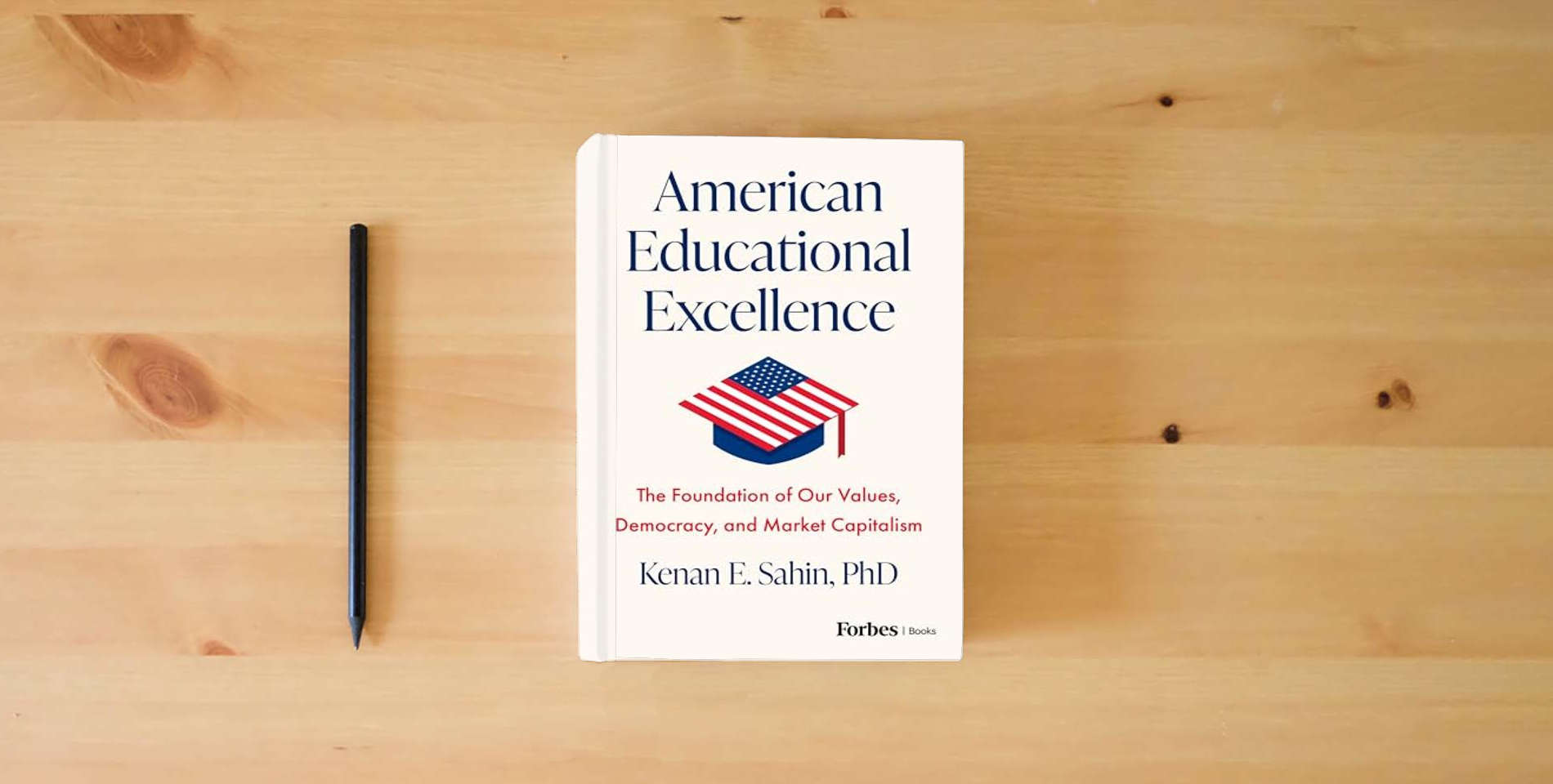 The book American Educational Excellence: The Foundation of Our Values, Democracy, and Market Capitalism is on the table