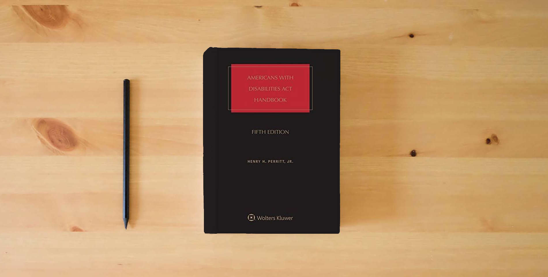 The book Americans With Disabilities Act Handbook is on the table