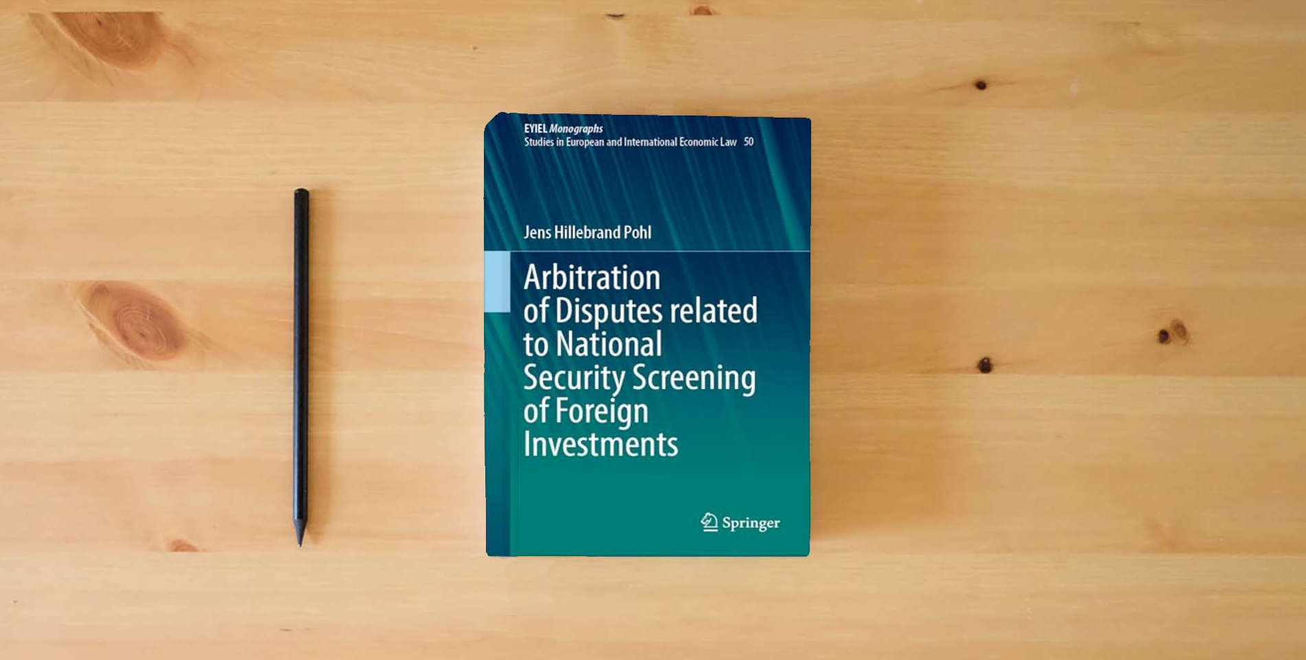 The book Arbitration of Disputes related to National Security Screening of Foreign Investments (European Yearbook of International Economic Law, 50) is on the table