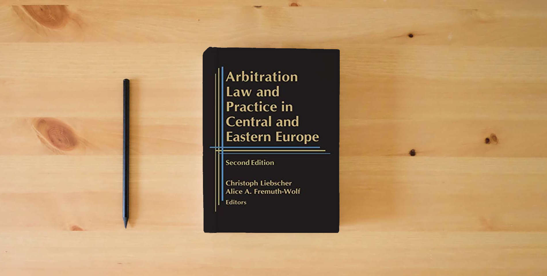 The book Arbitration Law and Practice in Central and Eastern Europe - Second Edition is on the table