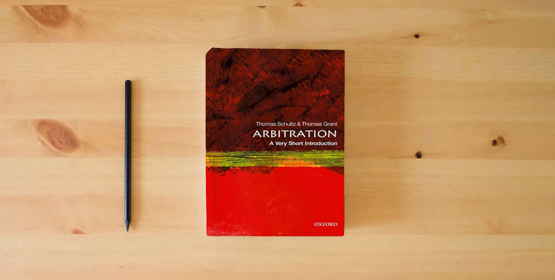 The book Arbitration: A Very Short Introduction is on the table
