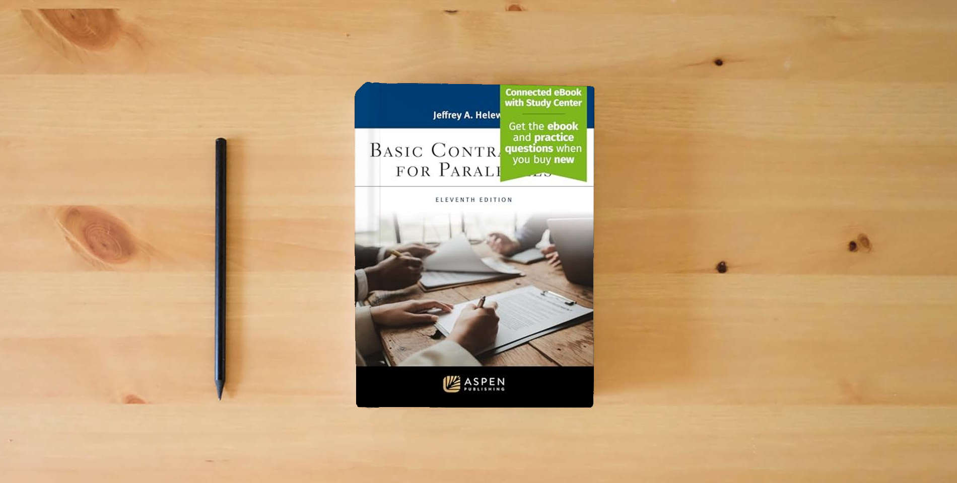 The book Basic Contract Law for Paralegals [Connected eBook with Study Center] (Aspen Paralegal Series) is on the table