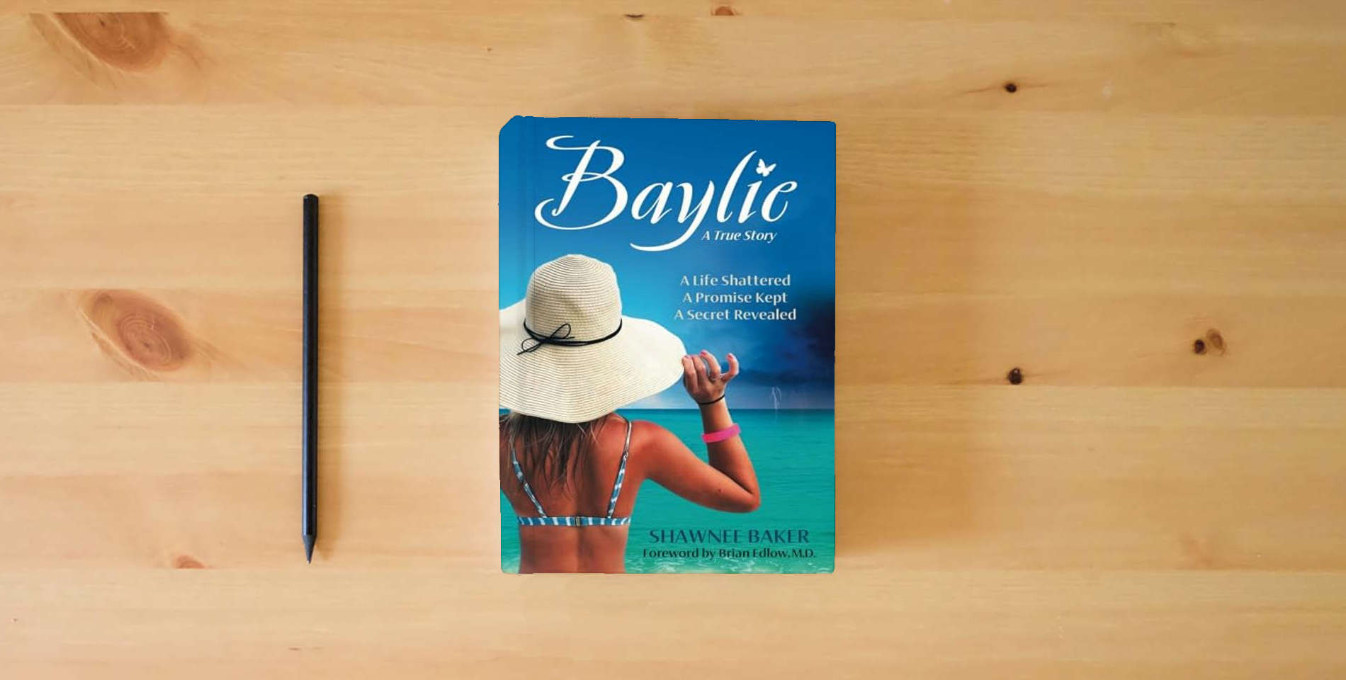 The book Baylie: A Life Shattered. A Promise Kept. A Secret Revealed. is on the table