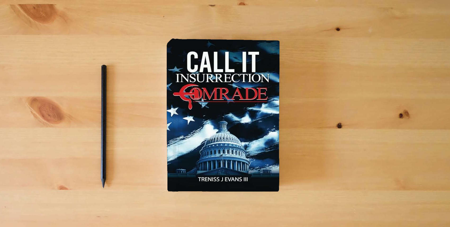 The book Call It Insurrection, Comrade: January 6th—None Dare Call It Justice is on the table