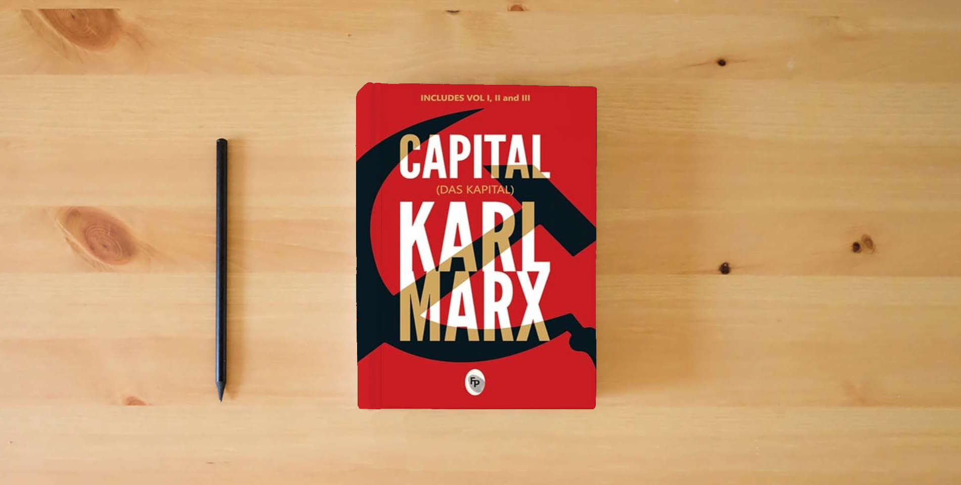 The book Capital (Das Capital): Includes Vol.1,2,3 - Classics (Fingerprint Classics) is on the table
