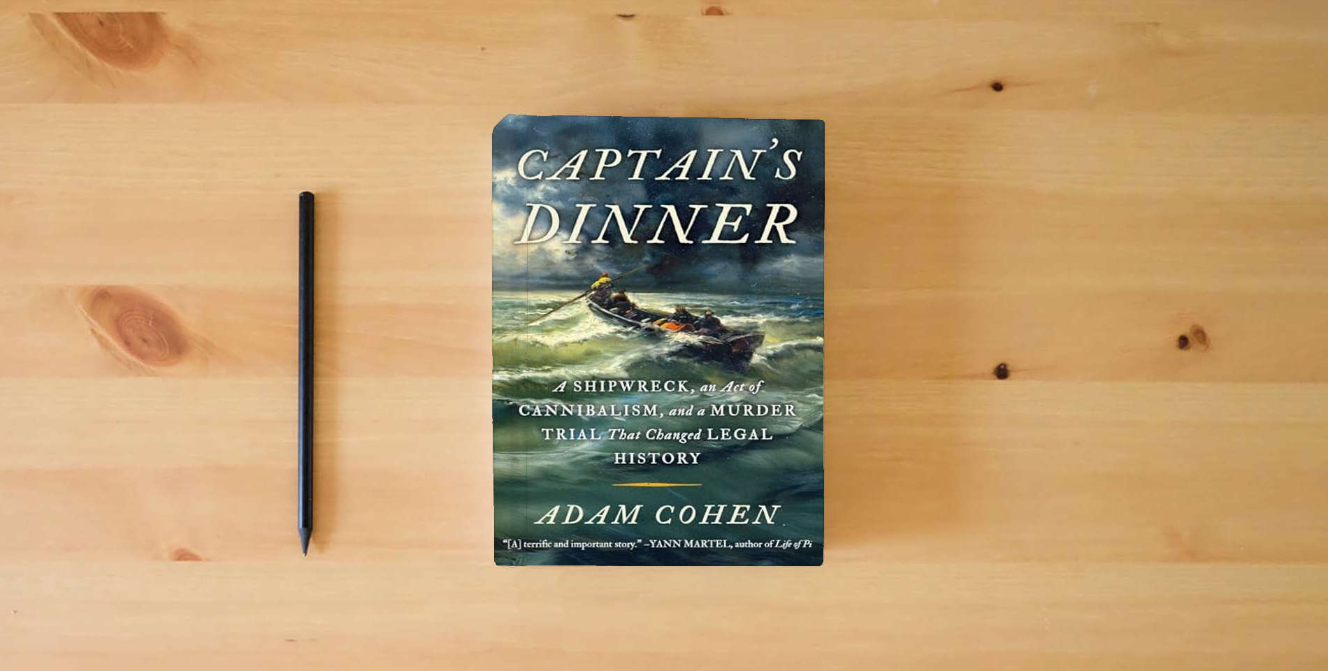 The book Captain's Dinner is on the table