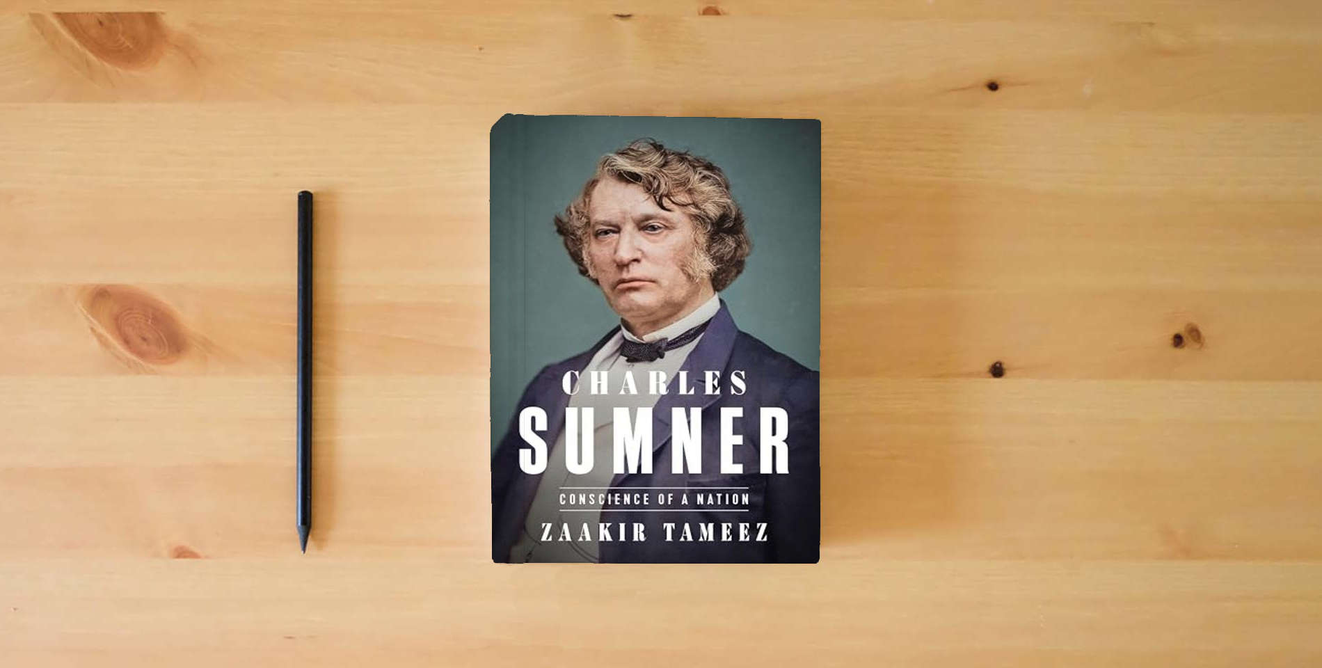 The book Charles Sumner: Conscience of a Nation is on the table
