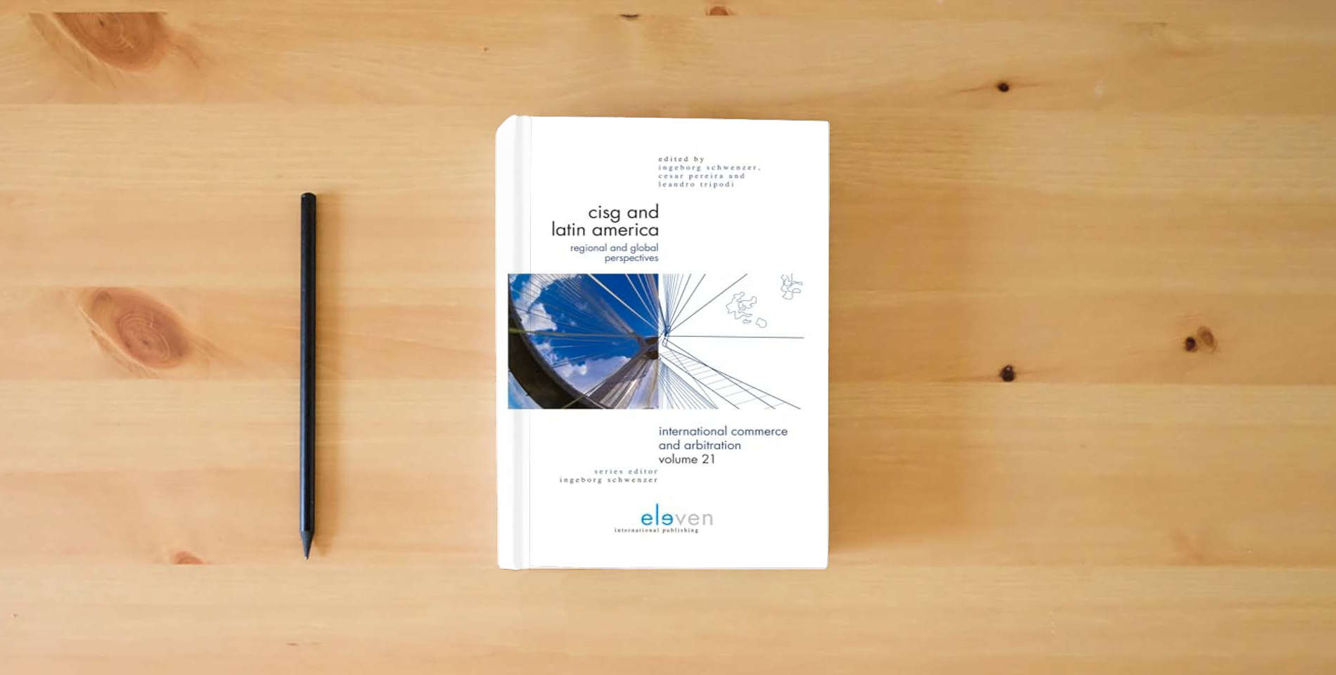 The book CISG and Latin America: Regional and Global Perspectives (21) (International Commerce and Arbitration) is on the table