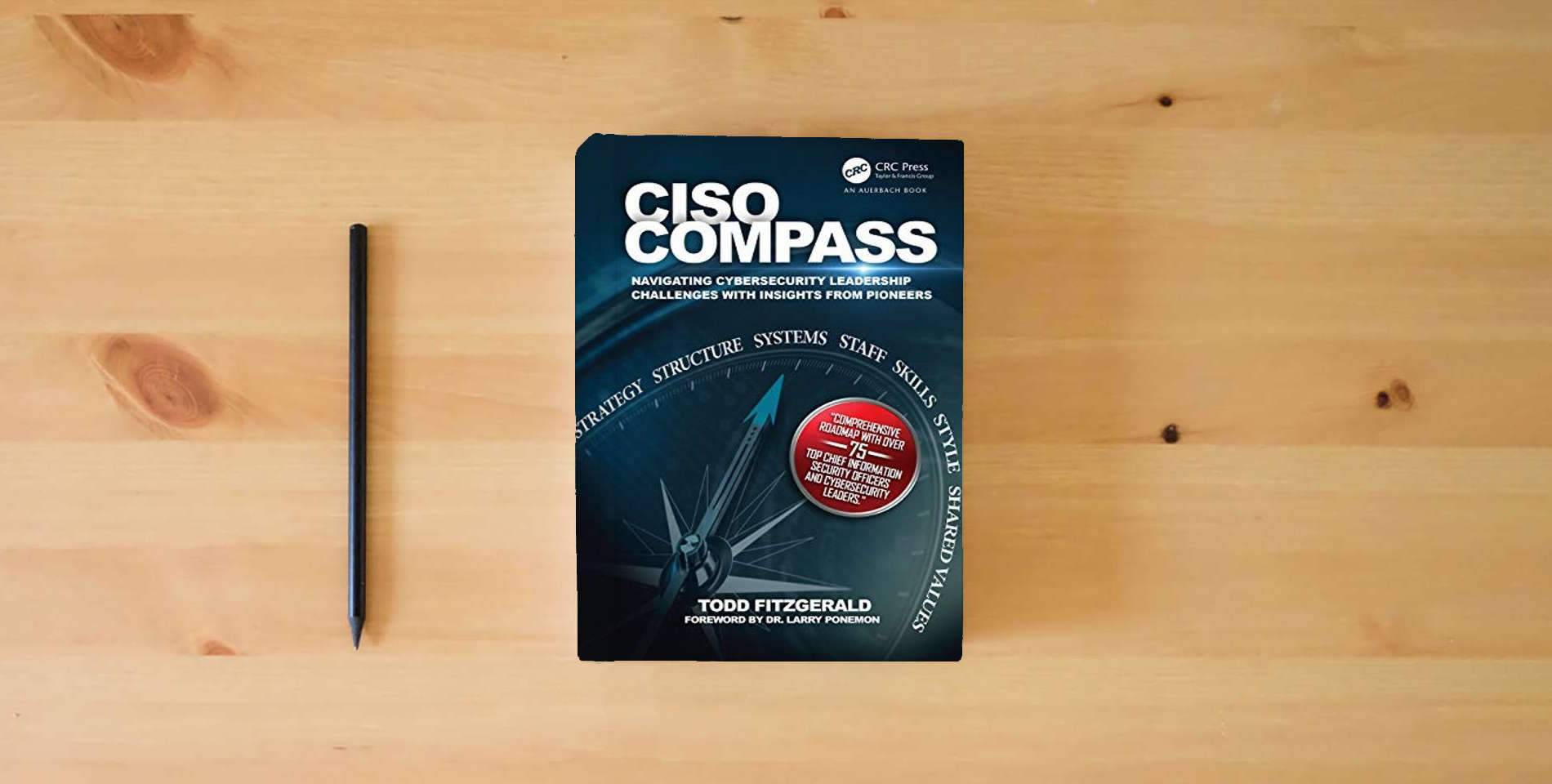 The book CISO COMPASS: Navigating Cybersecurity Leadership Challenges with Insights from Pioneers is on the table