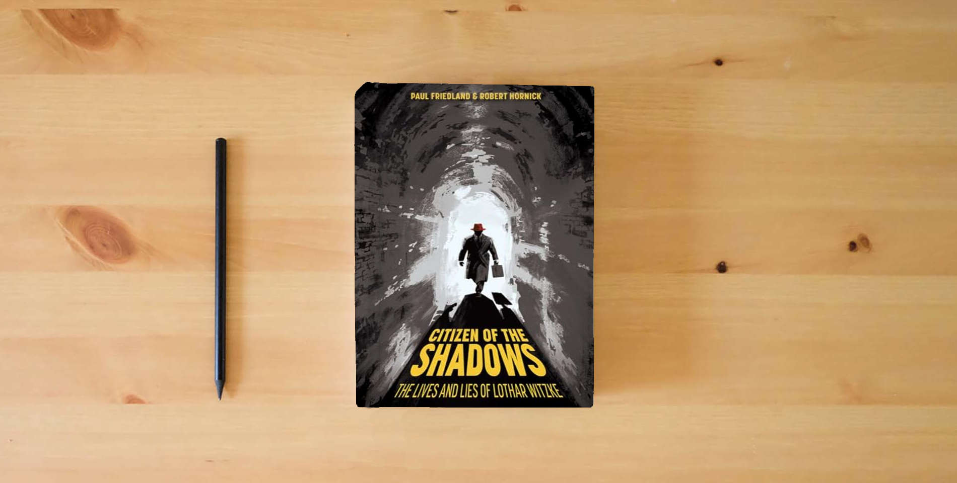 The book Citizen of the Shadows: The Lives and Lies of Lothar Witzke (Legacies of War) is on the table