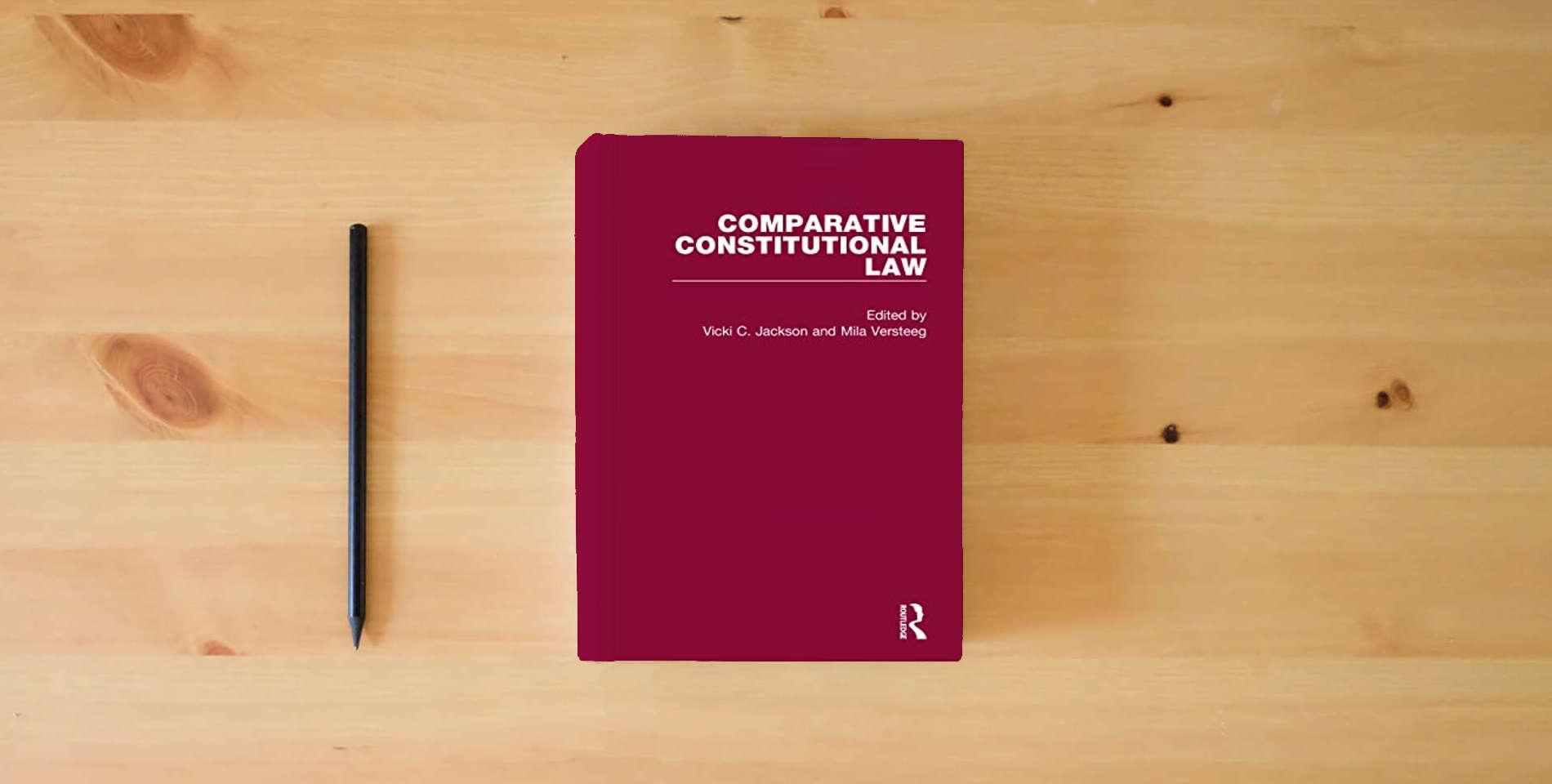 The book Comparative Constitutional Law (Critical Concepts in Law) is on the table