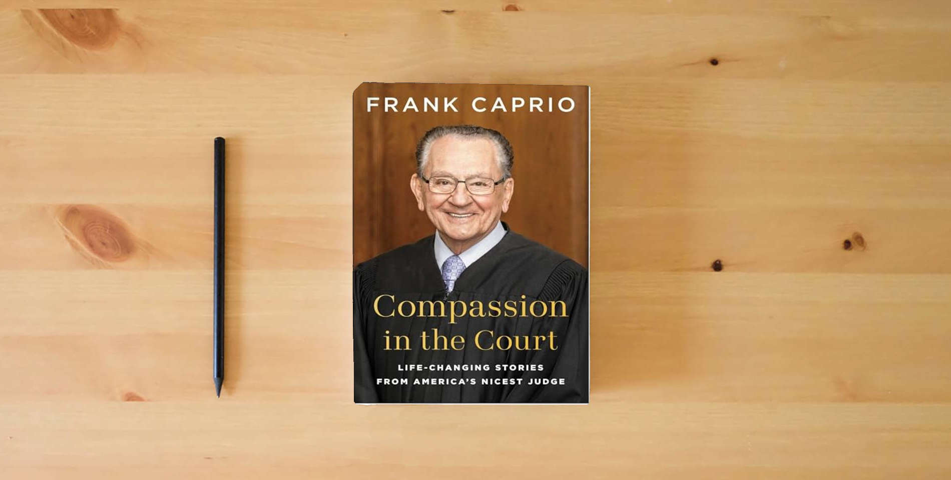 The book Compassion in the Court: Life-Changing Stories from America's Nicest Judge is on the table