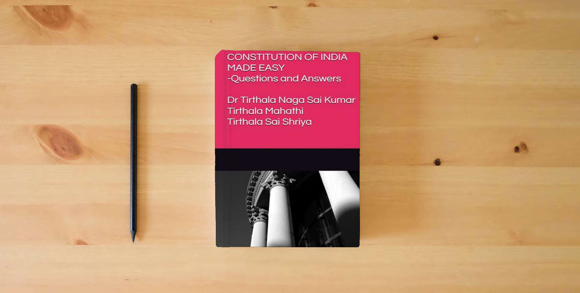 The book CONSTITUTION OF INDIA MADE EASY: Questions and Answers is on the table