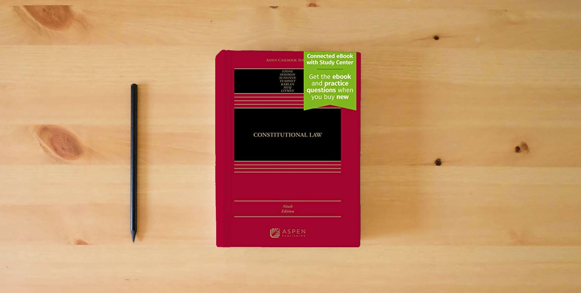 The book Constitutional Law: [Connected eBook with Study Center] (Aspen Casebook) is on the table
