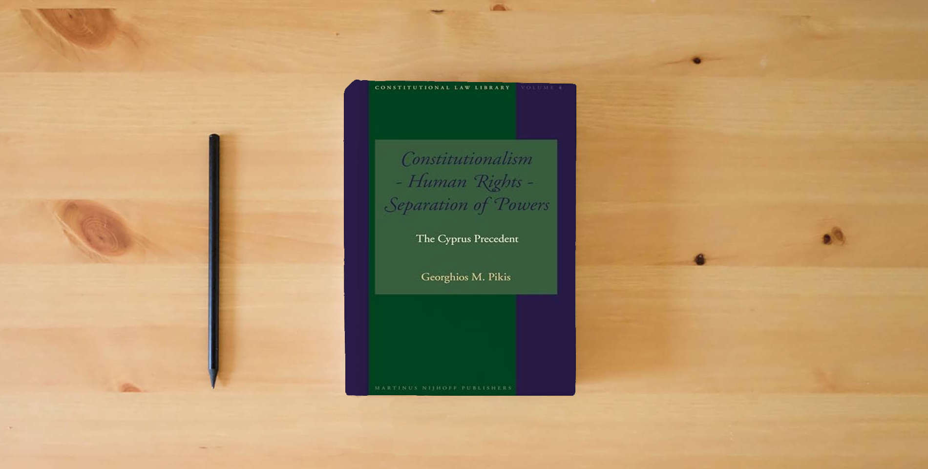 The book Constitutionalism - Human Rights - Separation of Powers: The Cyprus Precedent is on the table