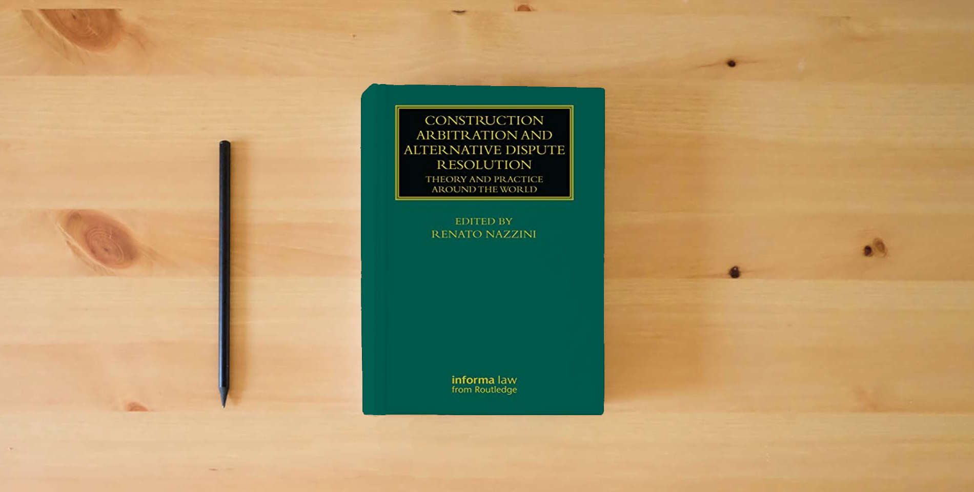The book Construction Arbitration and Alternative Dispute Resolution (Construction Practice Series) is on the table
