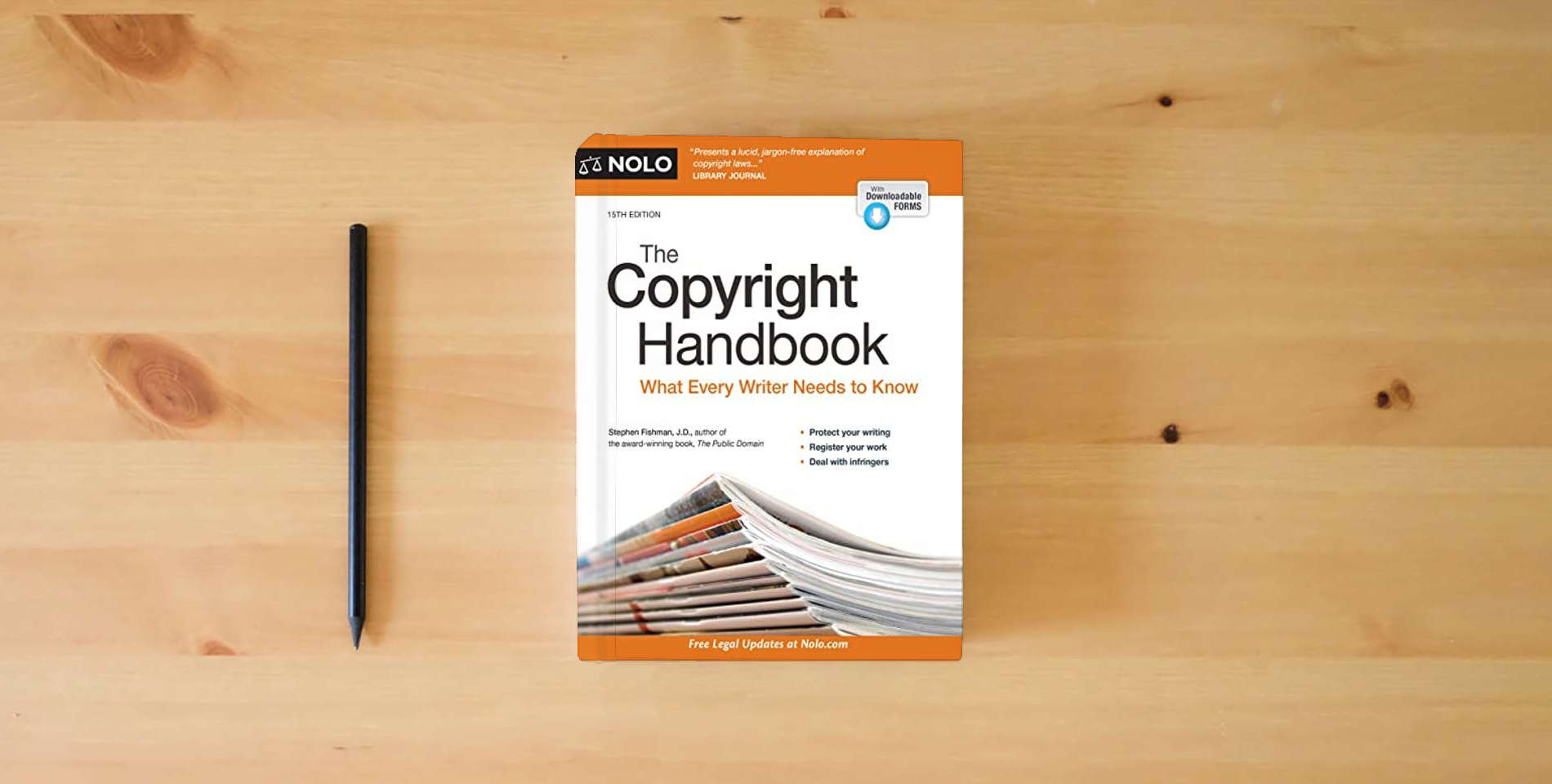 The book Copyright Handbook, The: What Every Writer Needs to Know is on the table