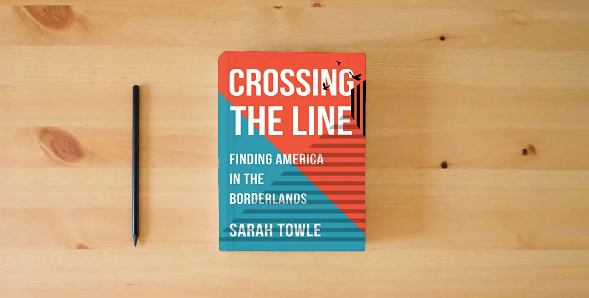The book Crossing the Line: Finding America in the Borderlands is on the table