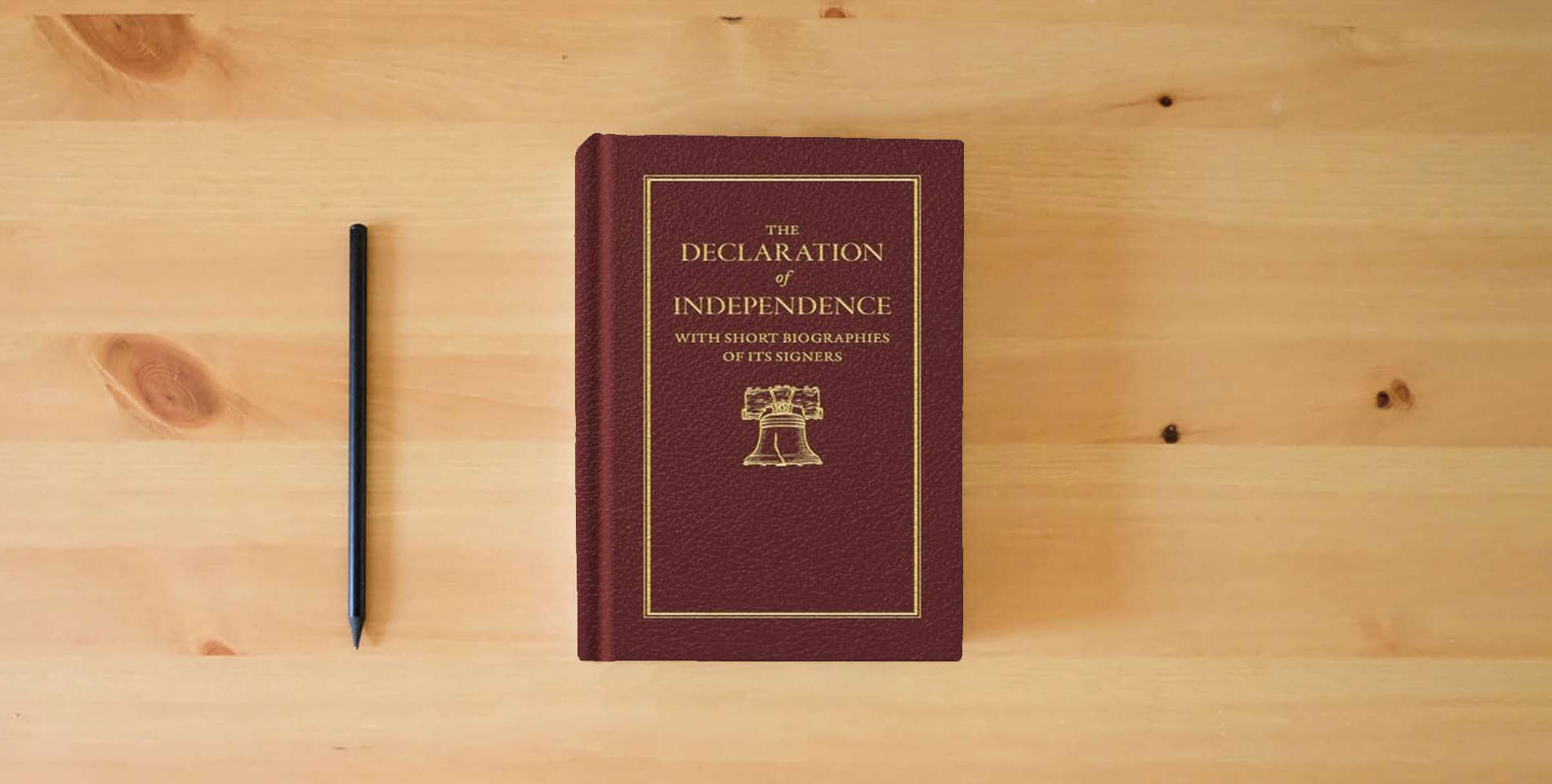 The book Declaration of Independence (Books of American Wisdom) is on the table