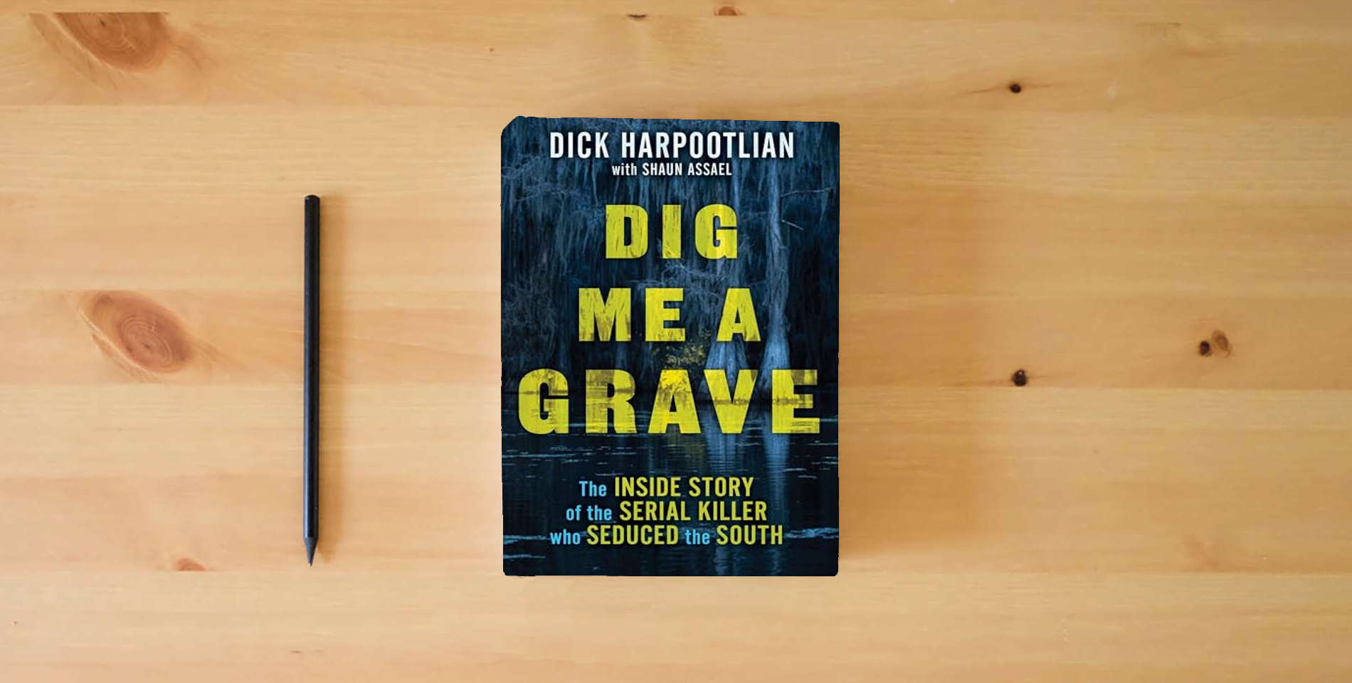 The book Dig Me a Grave: The Inside Story of the Serial Killer Who Seduced the South is on the table