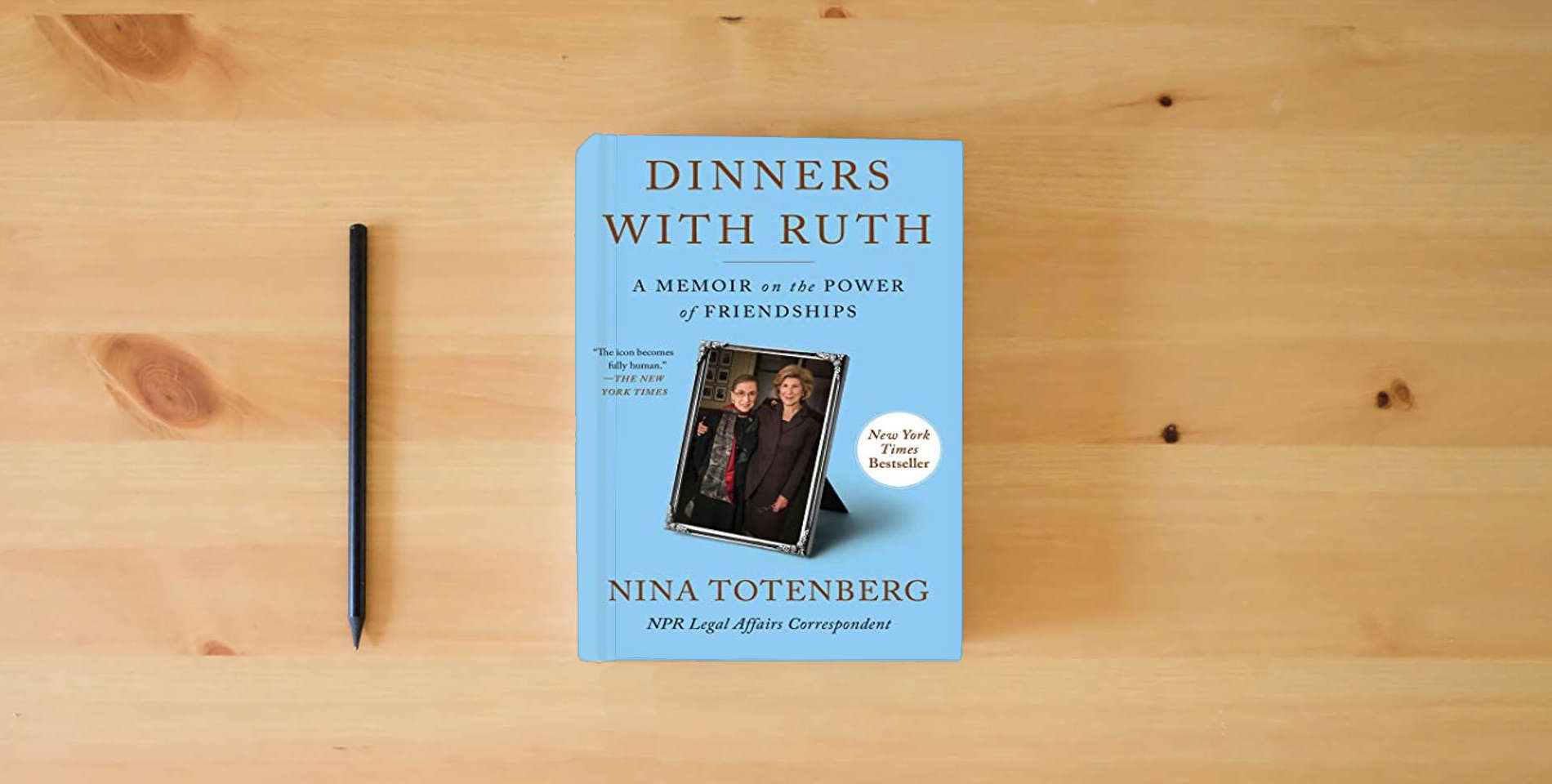The book Dinners with Ruth: A Memoir on the Power of Friendships is on the table