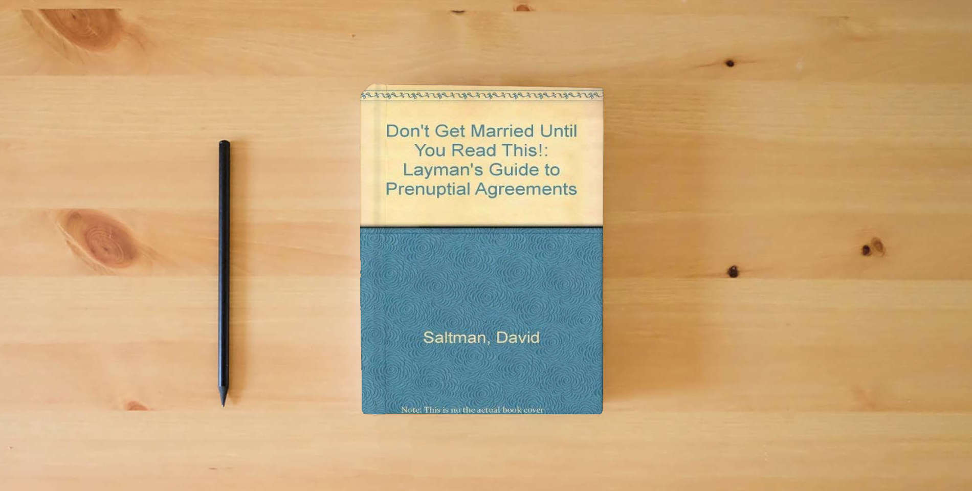 The book Don't Get Married Until You Read This: A Layman's Guide to Prenuptial Agreements is on the table