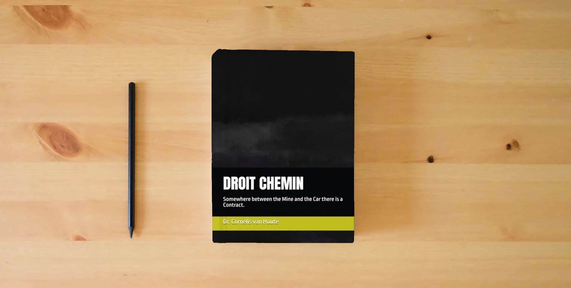 The book DROIT CHEMIN: Somewhere between the Mine and the Car there is a Contract. (AFRICA V.) is on the table
