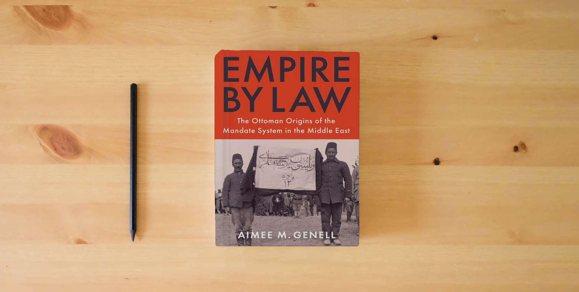 The book Empire by Law: The Ottoman Origins of the Mandate System in the Middle East (Columbia Studies in International and Global History) is on the table