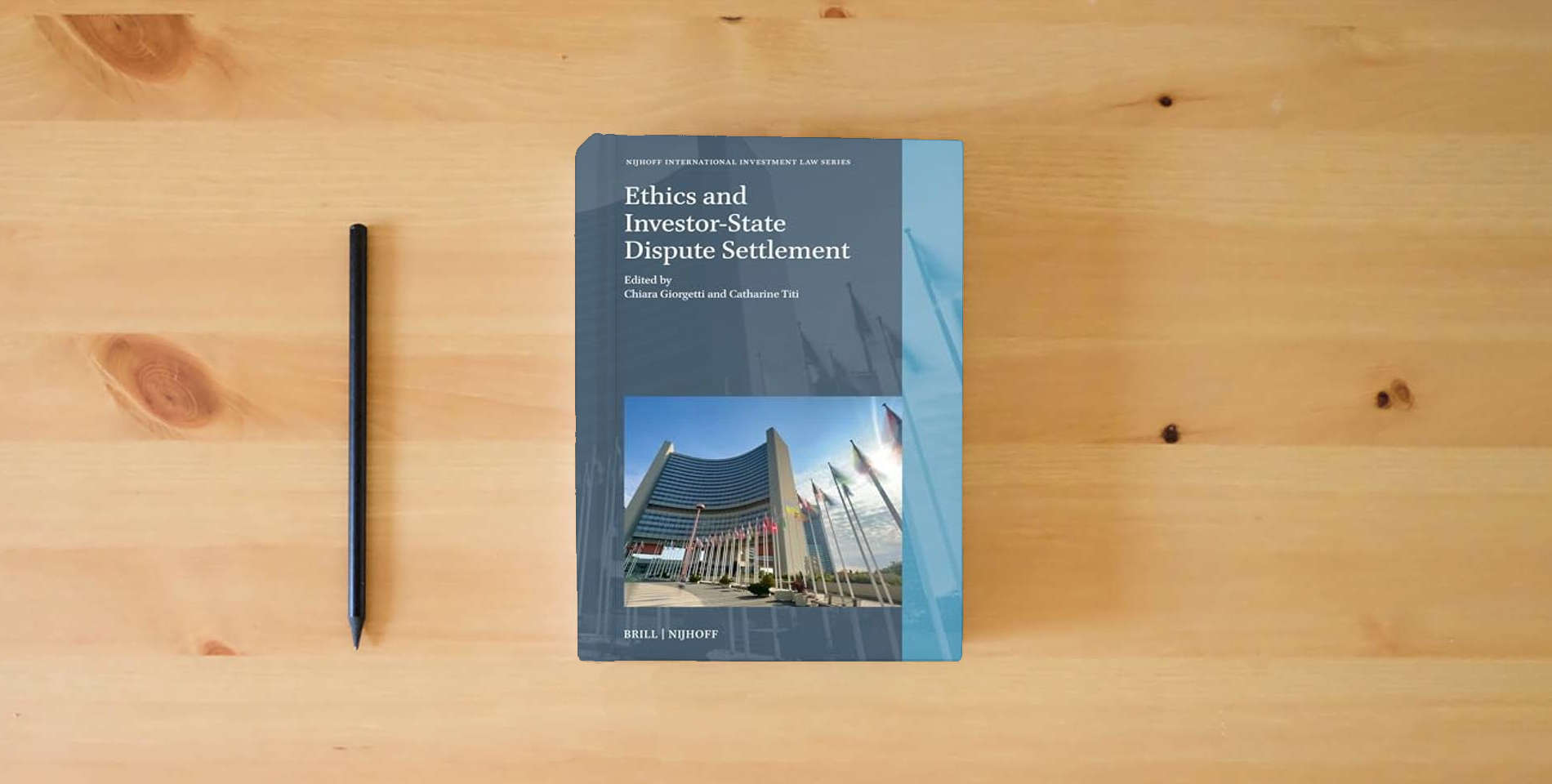 The book Ethics and Investor-State Dispute Settlement (Nijhoff International Investment Law Series, 29) is on the table