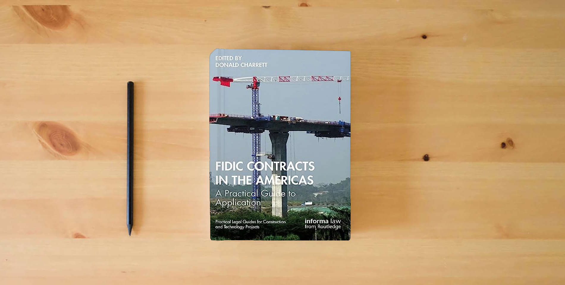 The book FIDIC Contracts in the Americas (Practical Legal Guides for Construction and Technology Projects) is on the table
