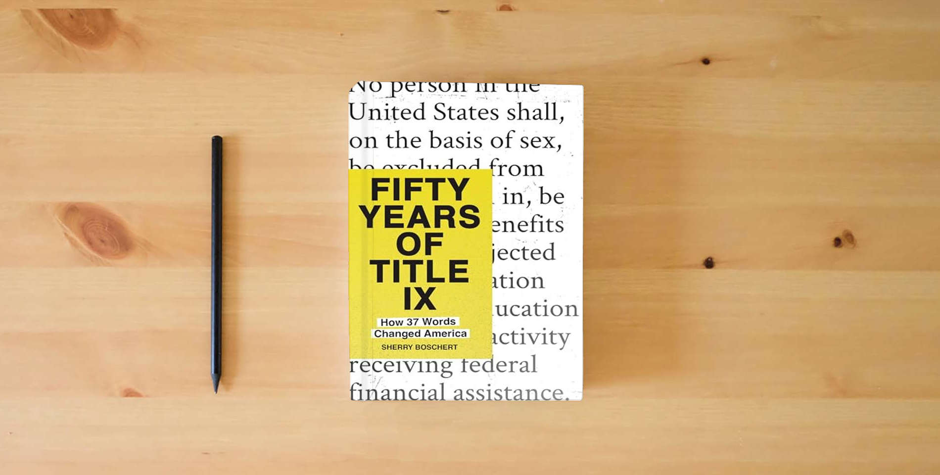 The book Fifty Years of Title IX: How 37 Words Changed America is on the table