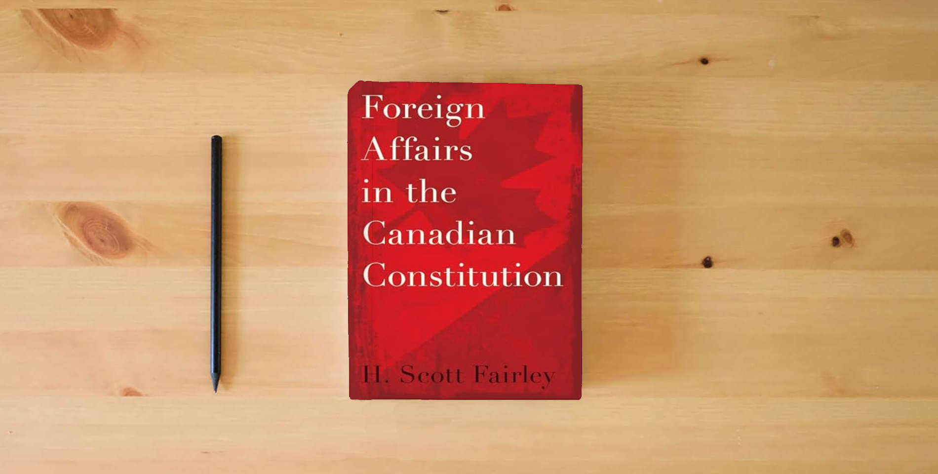 The book Foreign Affairs in the Canadian Constitution is on the table