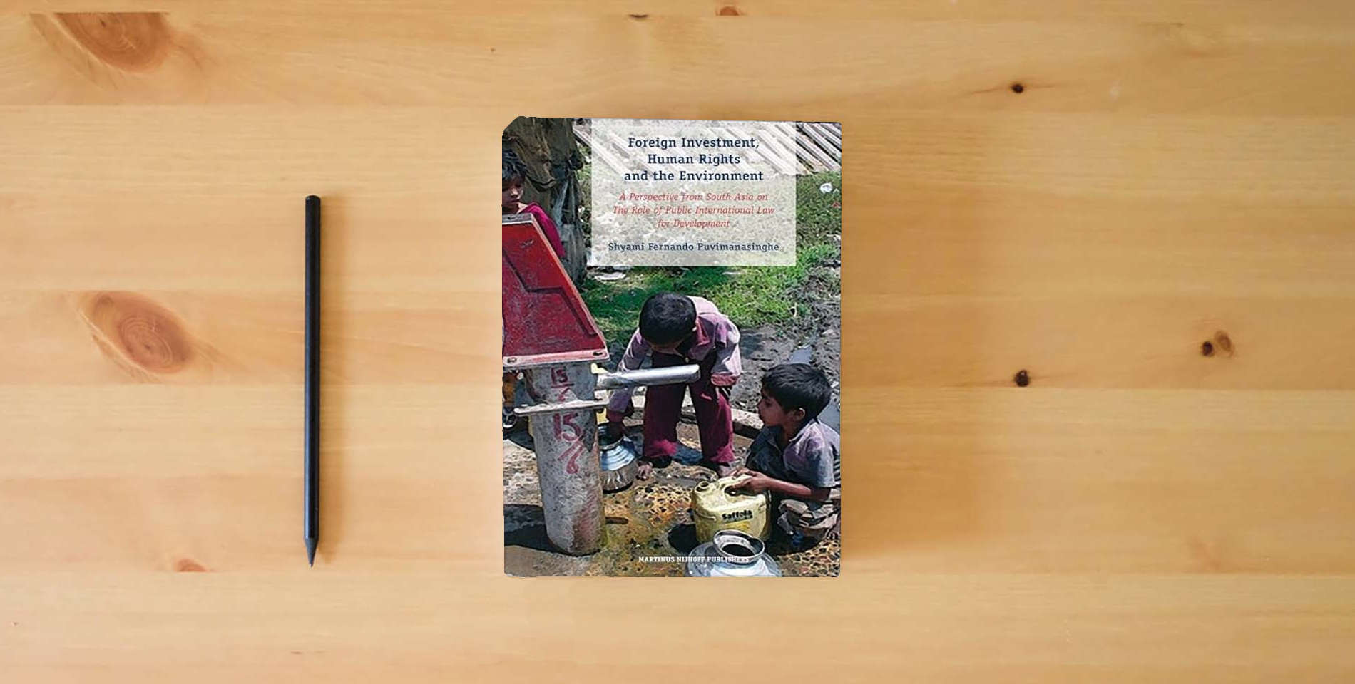 The book Foreign Investment, Human Rights and the Environment: A Perspective from South Asia on The Role of Public International Law for Development is on the table