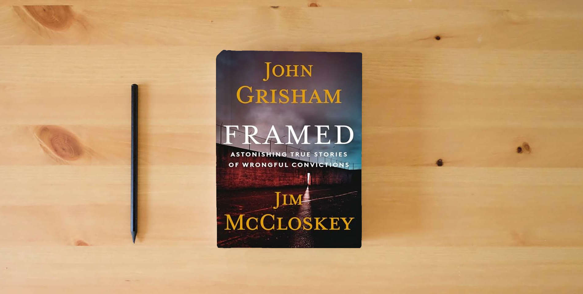 The book Framed: Astonishing True Stories of Wrongful Convictions is on the table