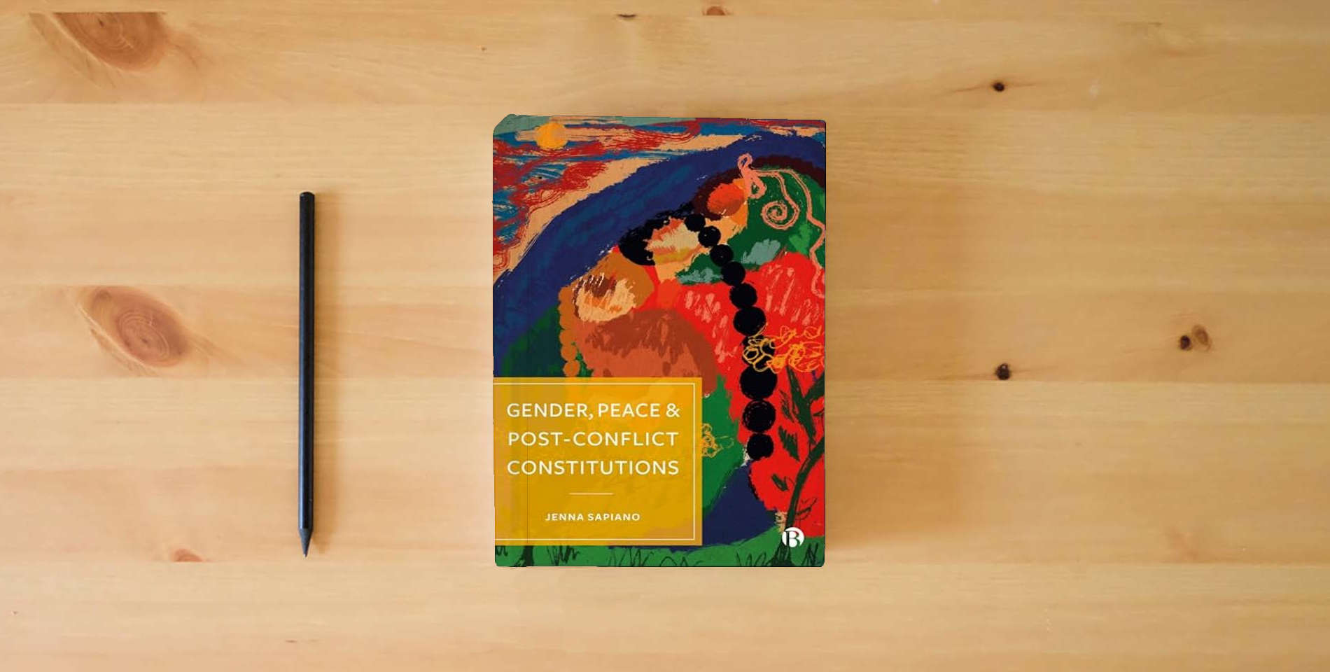 The book Gender, Peace and Post-Conflict Constitutions is on the table