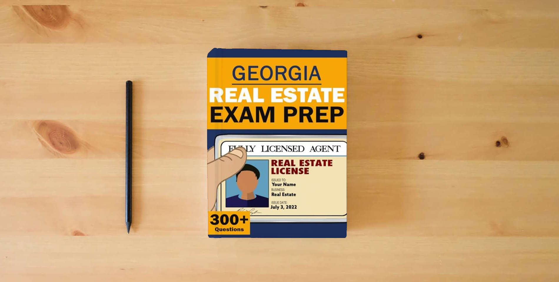 The book Georgia Real Estate License Exam Prep - Real Estate Broker Exam Prep Georgia Test - Real Estate Law Study Guide (National Real Estate Exam) is on the table
