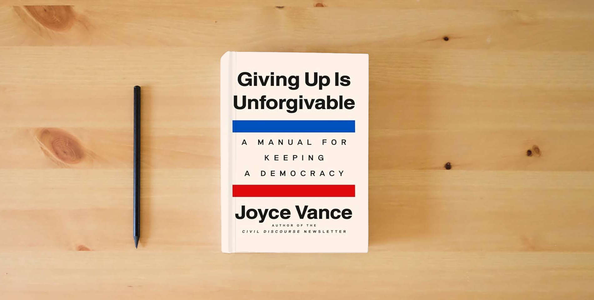 The book Giving Up Is Unforgivable: A Manual for Keeping a Democracy is on the table