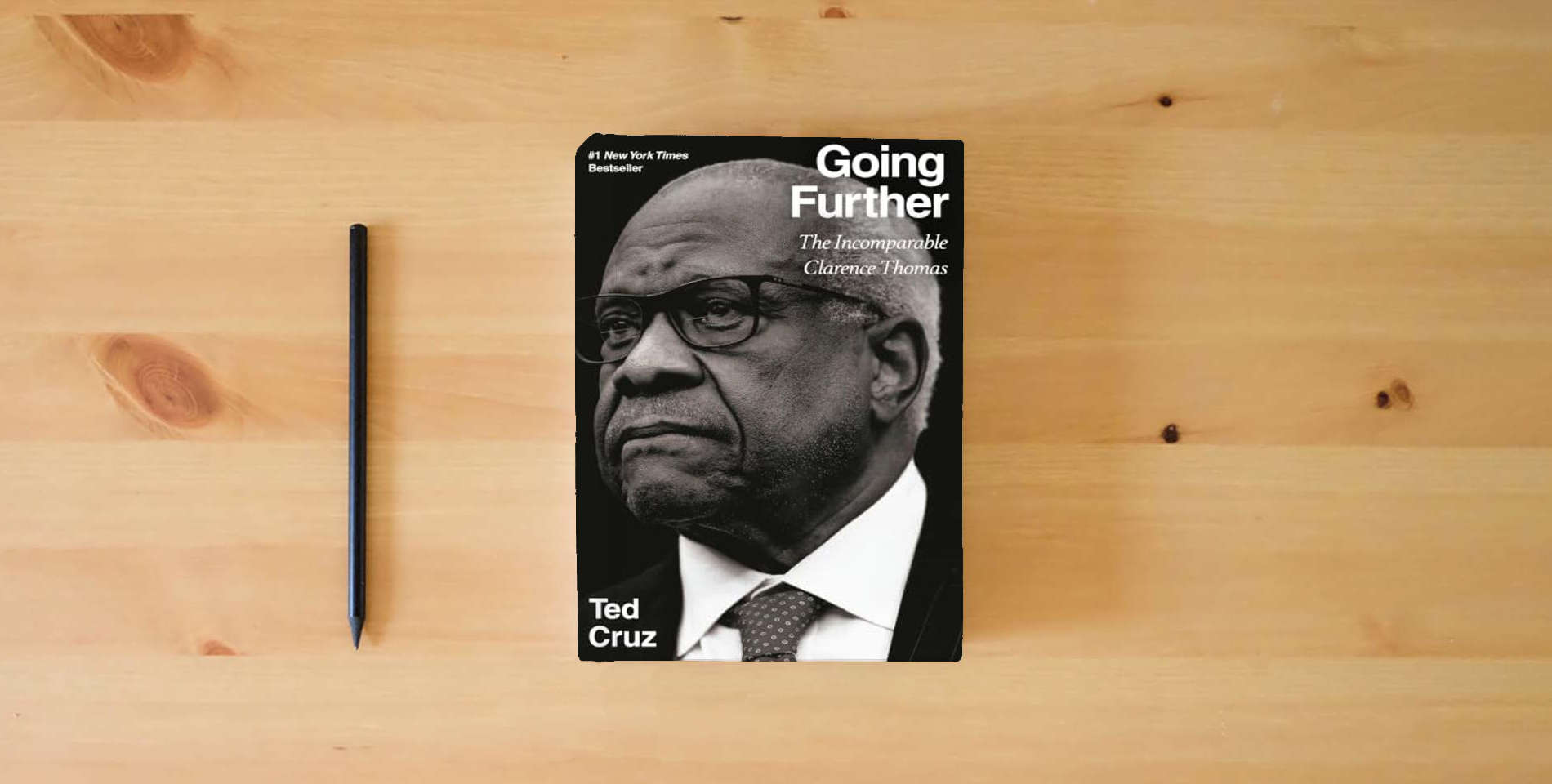 The book Going Further: The Incomparable Clarence Thomas is on the table