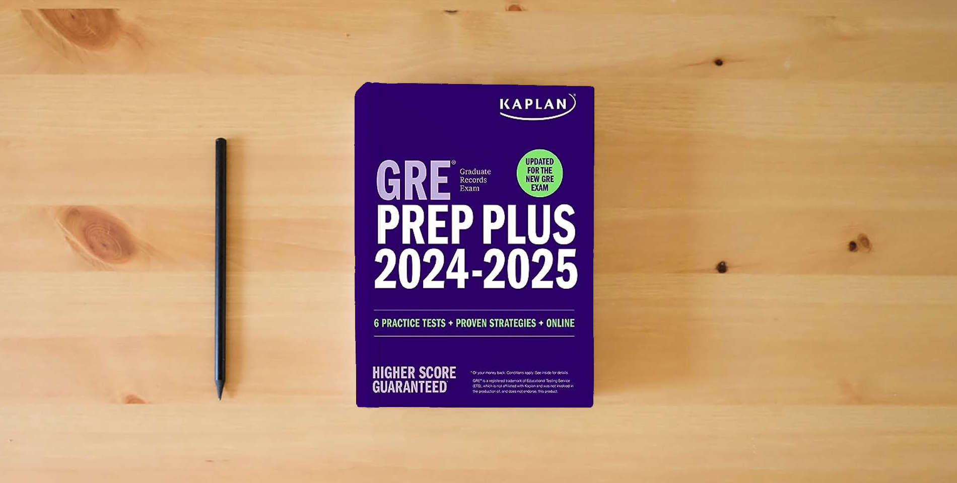 The book GRE Prep Plus 2024-2025 - Updated for the New GRE (Kaplan Test Prep) is on the table