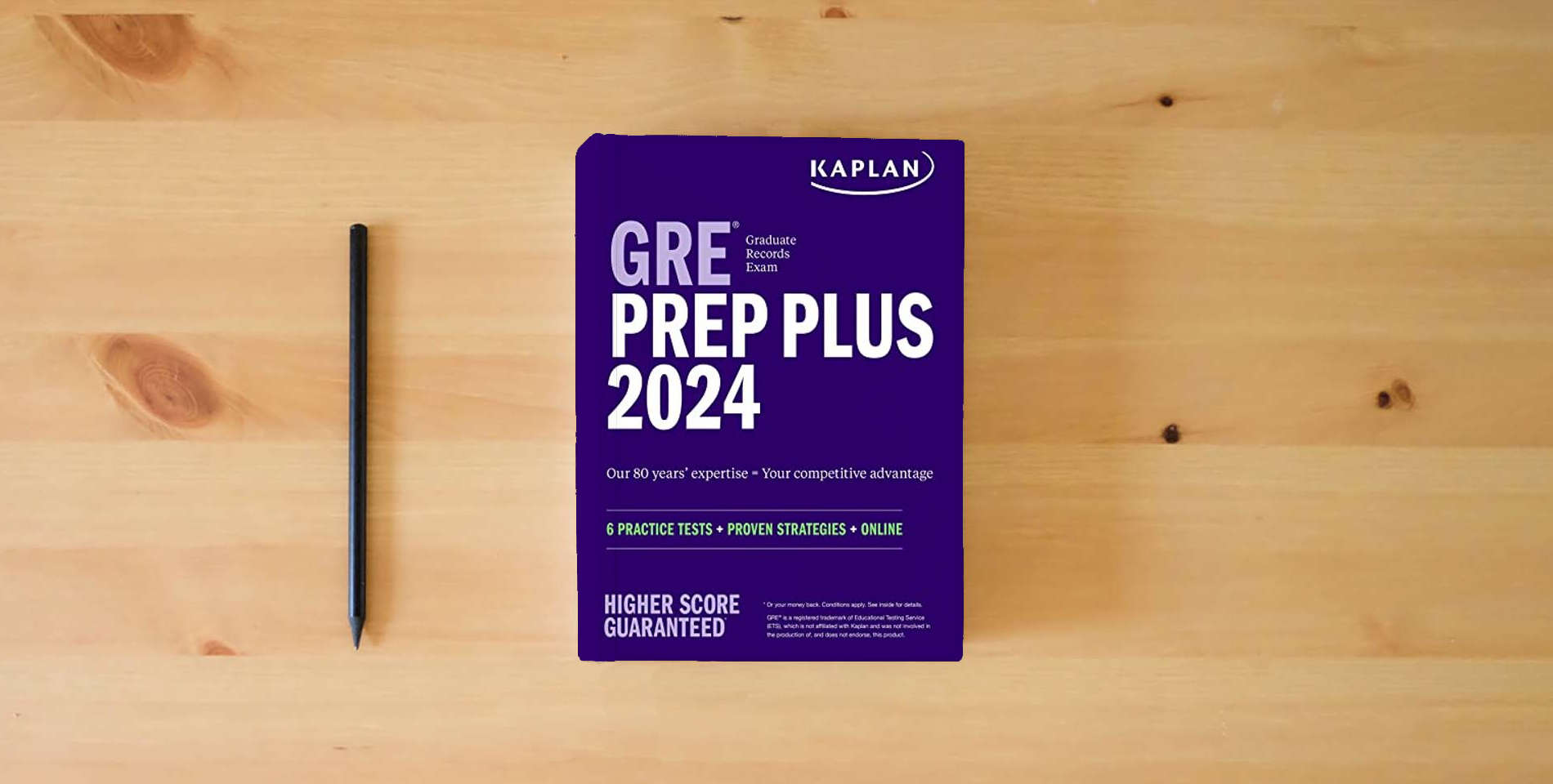 The book GRE Prep Plus 2024: 6 Practice Tests + Proven Strategies + Online (Kaplan Test Prep) is on the table