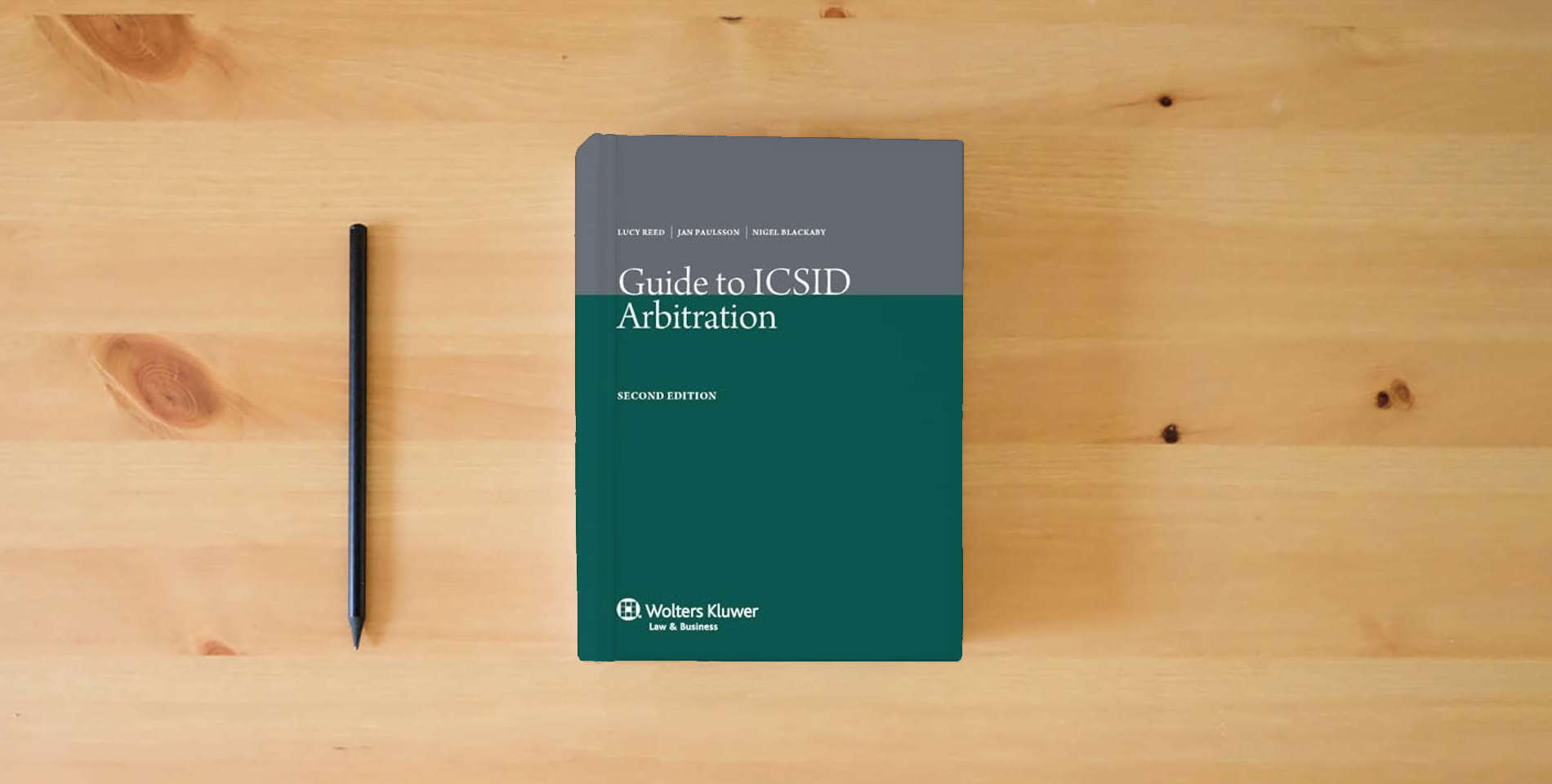 The book Guide to ICSID Arbitration 2nd Edition Revised is on the table