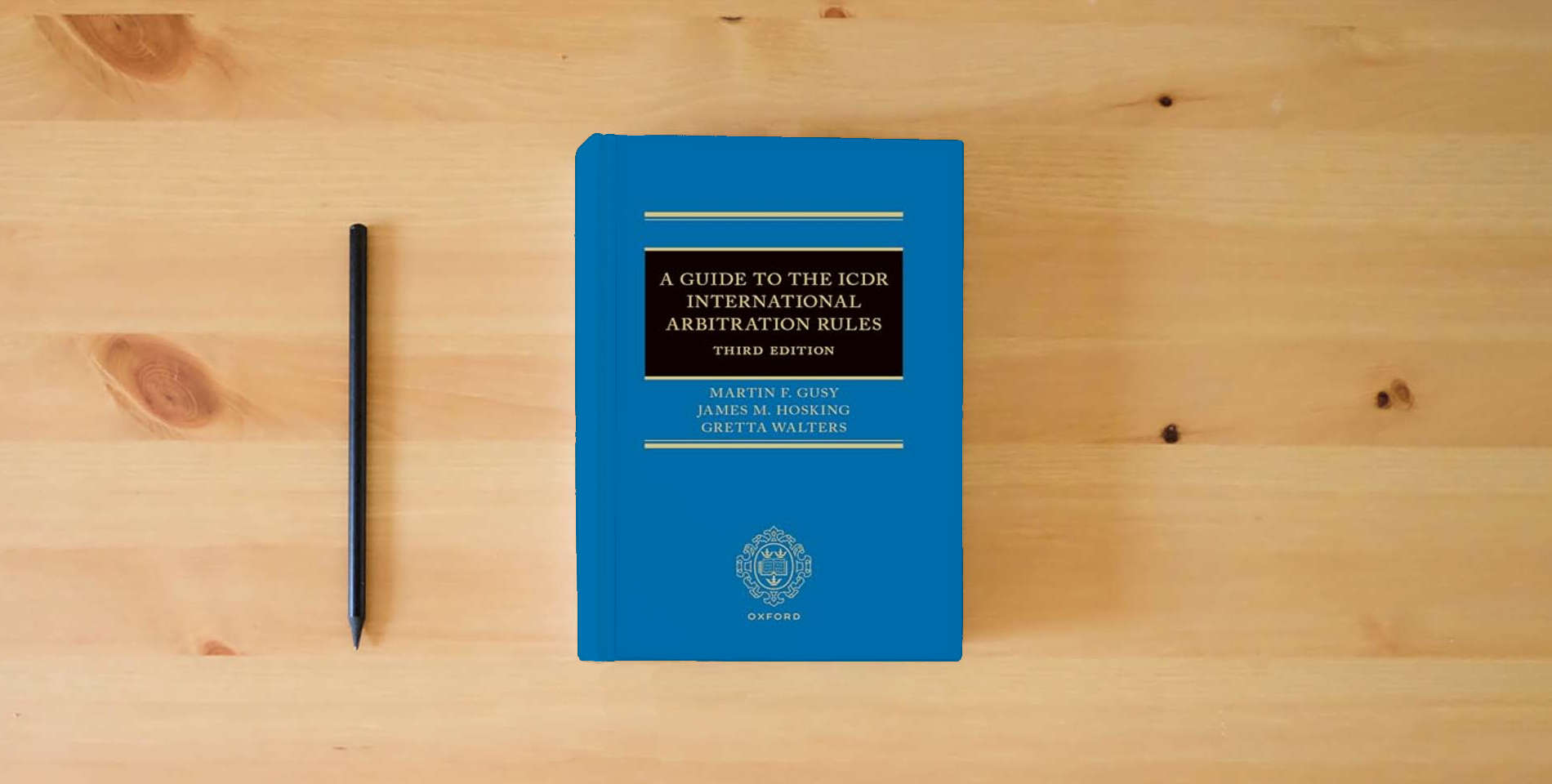 The book A Guide to the ICDR International Arbitration Rules is on the table