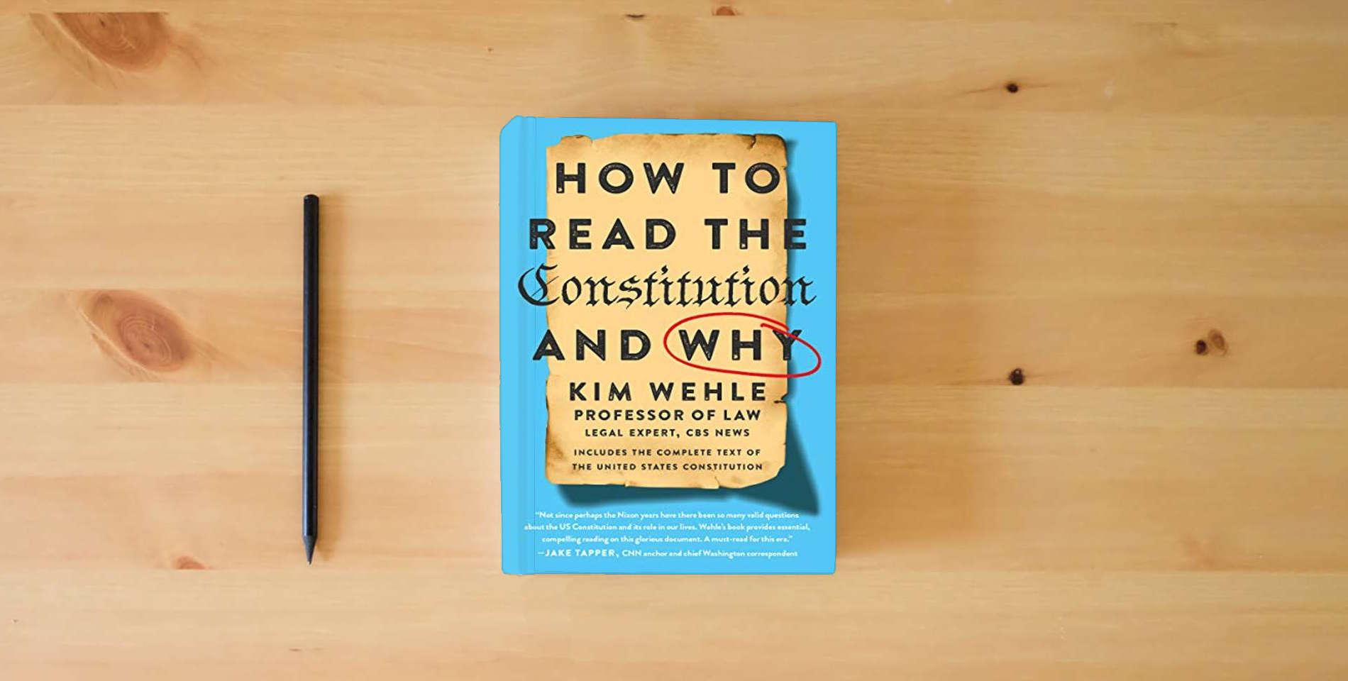 The book How to Read the Constitution--and Why (Legal Expert Series, 1) is on the table