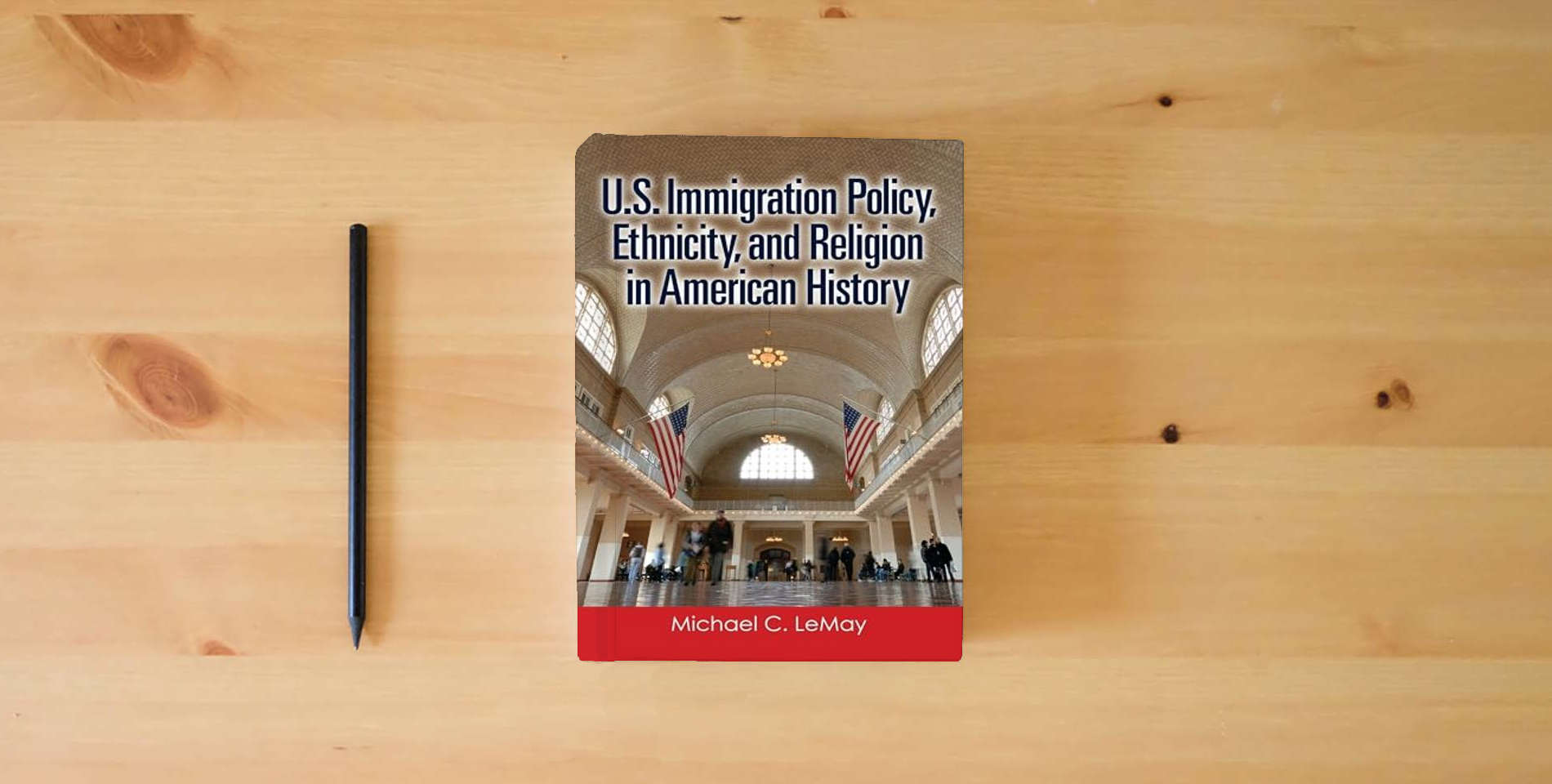 The book U.S. Immigration Policy, Ethnicity, and Religion in American History is on the table