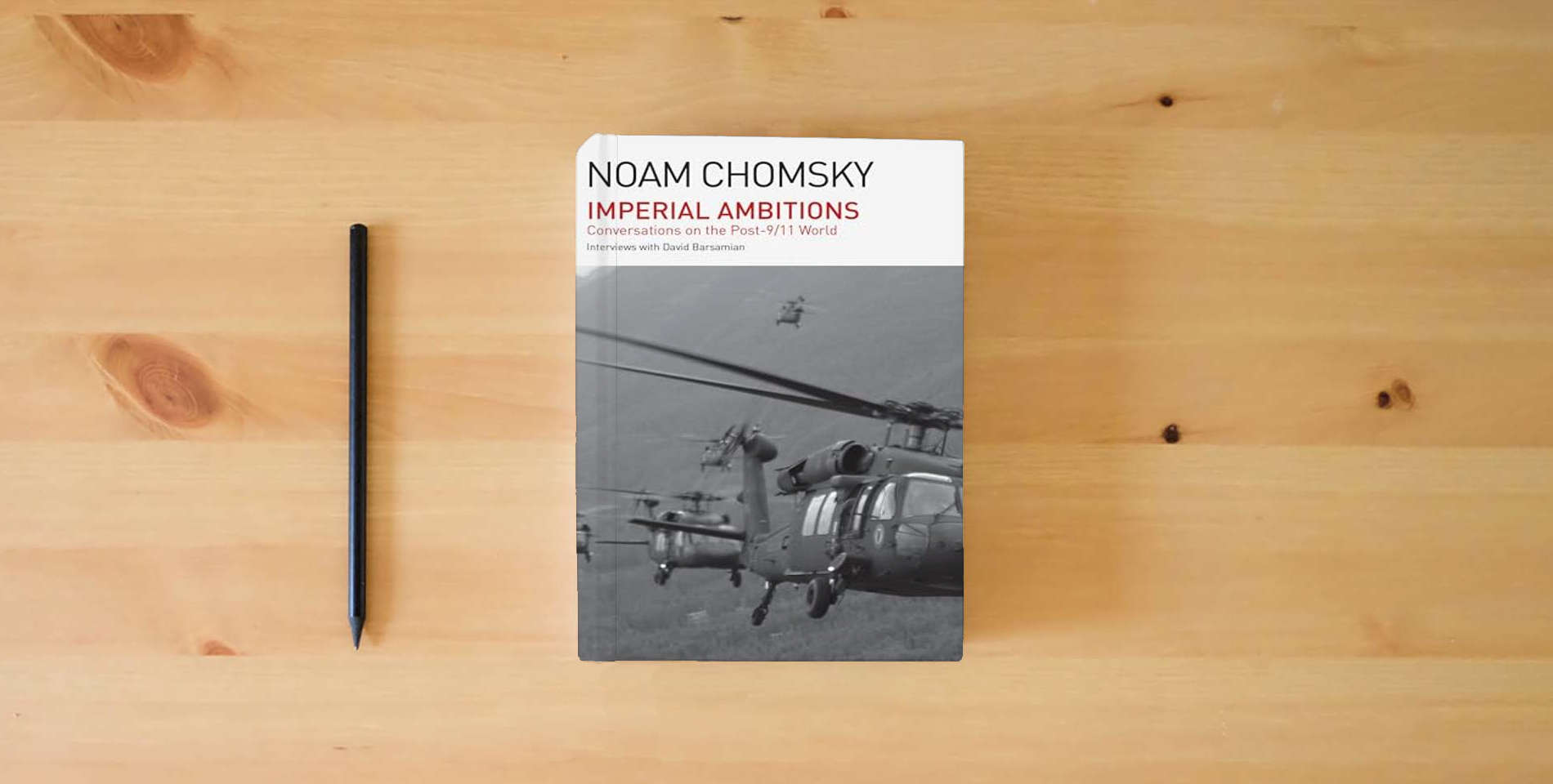 The book Imperial Ambitions: Conversations on the Post-9/11 World is on the table