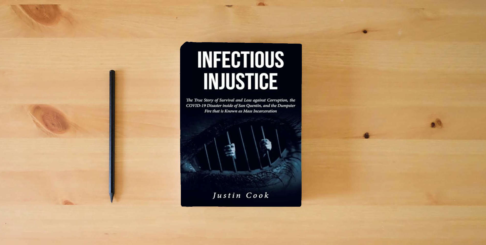 The book Infectious Injustice: The True Story of Survival and Loss against Corruption, the COVID-19 Disaster inside of San Quentin, and the Dumpster Fire that is Known as Mass Incarceration is on the table