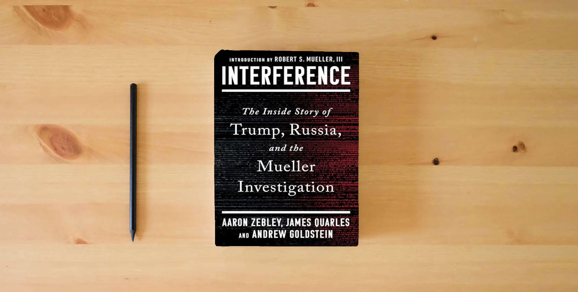 The book Interference: The Inside Story of Trump, Russia, and the Mueller Investigation is on the table